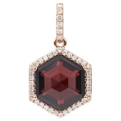 Sunita Nahata Garnet 6.77ct. Pendant in 18KRG with Diamond.
