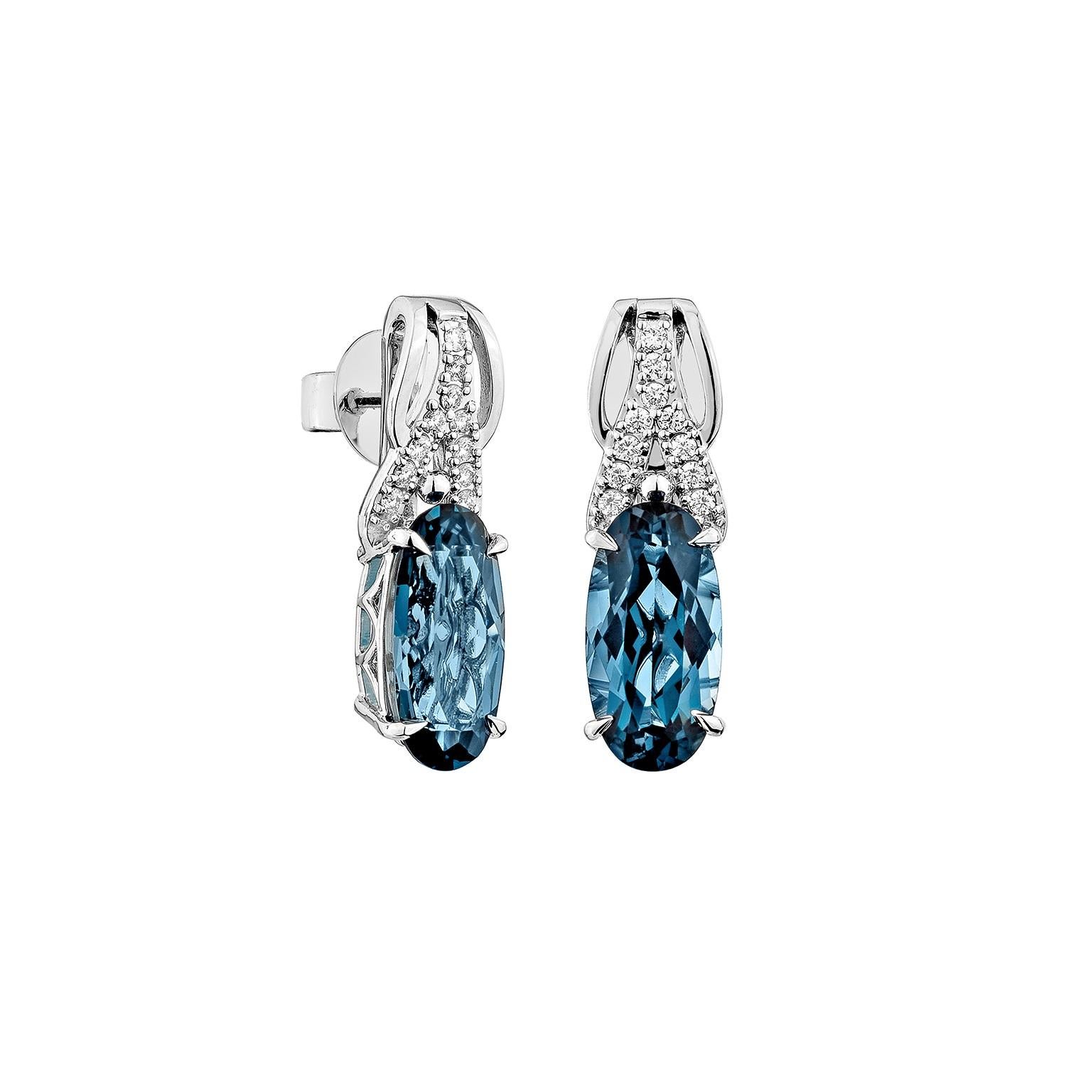 Sophisticated and captivating, these drop earrings feature oval-shaped London blue topaz gemstones, elegantly paired with shimmering white diamonds. Crafted in 14K white gold, they offer a timeless allure for any occasion.

London Blue Topaz Drop