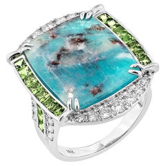 Sunita Nahata Paraiba 7.38ct. Anillo Fantasía en 18KWG con Tsavorita y Diamante.