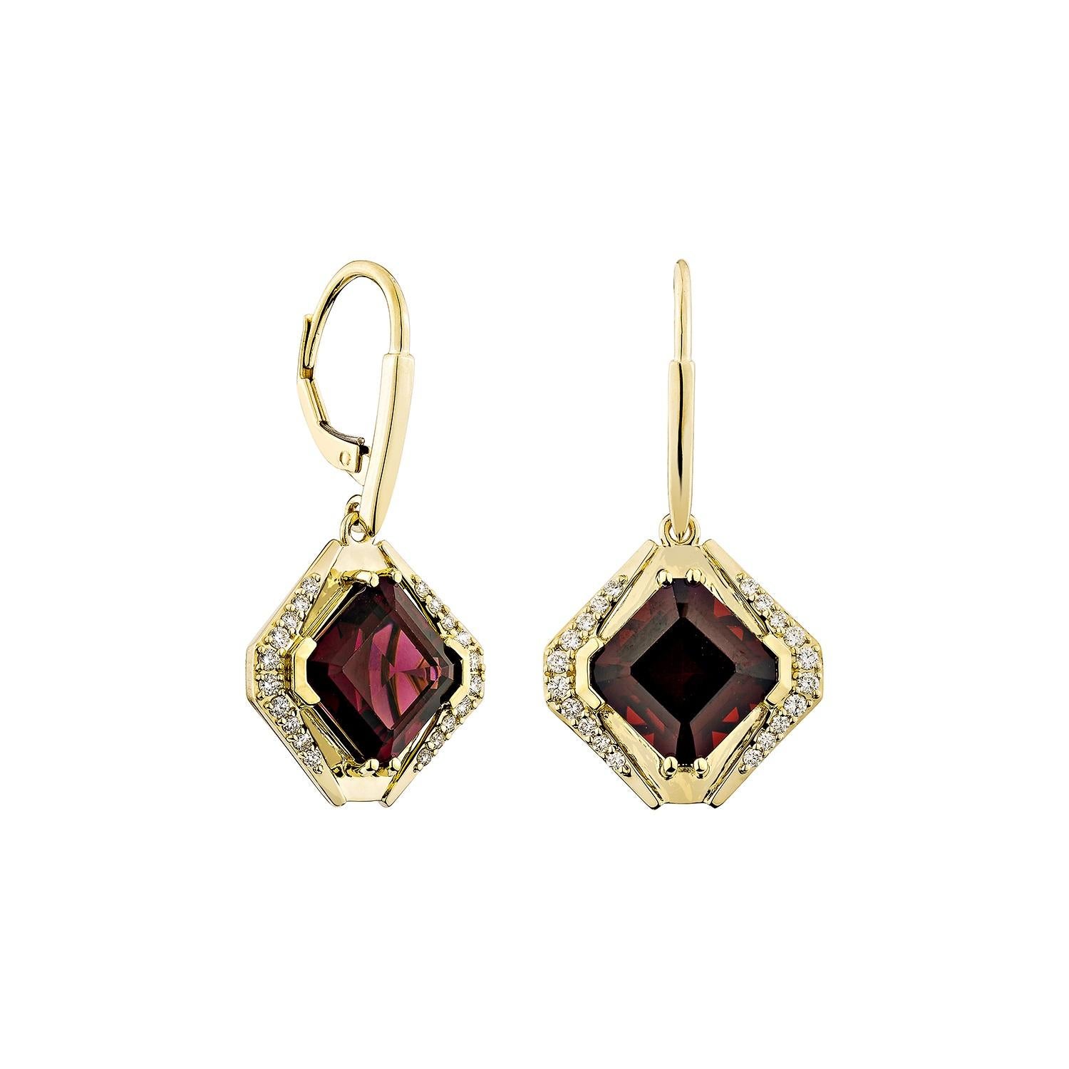 Elegant drop earrings featuring richly hued red garnets framed in 14K yellow gold and accented with sparkling white diamonds. A bold yet timeless design with lever-back closures for secure wear.

Red Garnet Drop Earrings in 14Karat Yellow Gold with