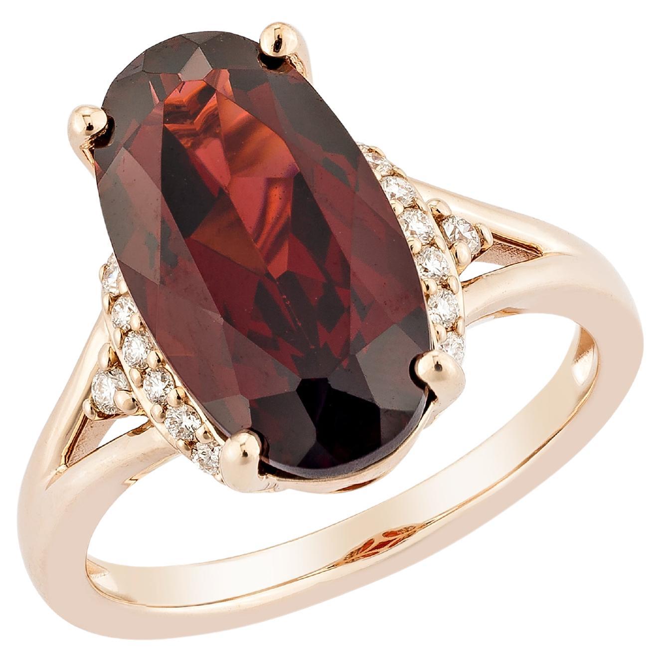 Granato rosso Sunita Nahata 6.02ct. Anello fantasia in 14KRG con diamante bianco.