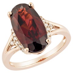 Granato rosso Sunita Nahata 6.02ct. Anello fantasia in 14KRG con diamante bianco.