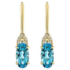 Sunita Nahata topaze bleue suisse 5.80 carats. Boucle d'oreille pendante en 14KYG avec diamant.