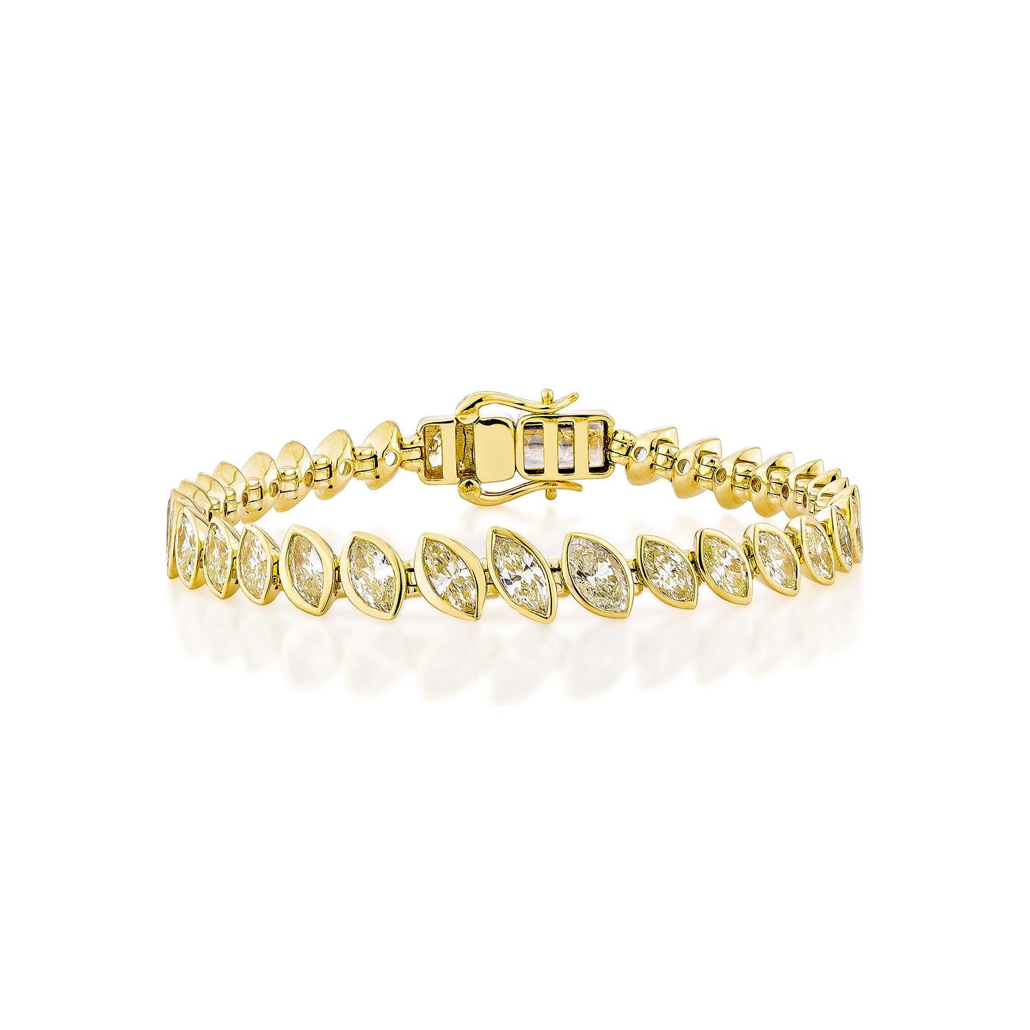A striking tennis bracelet featuring a continuous row of marquise-cut yellow diamonds, each bezel-set in rich 18K yellow gold for a sleek and modern finish. Its elegant silhouette and secure clasp make it a timeless luxury piece—perfect for everyday