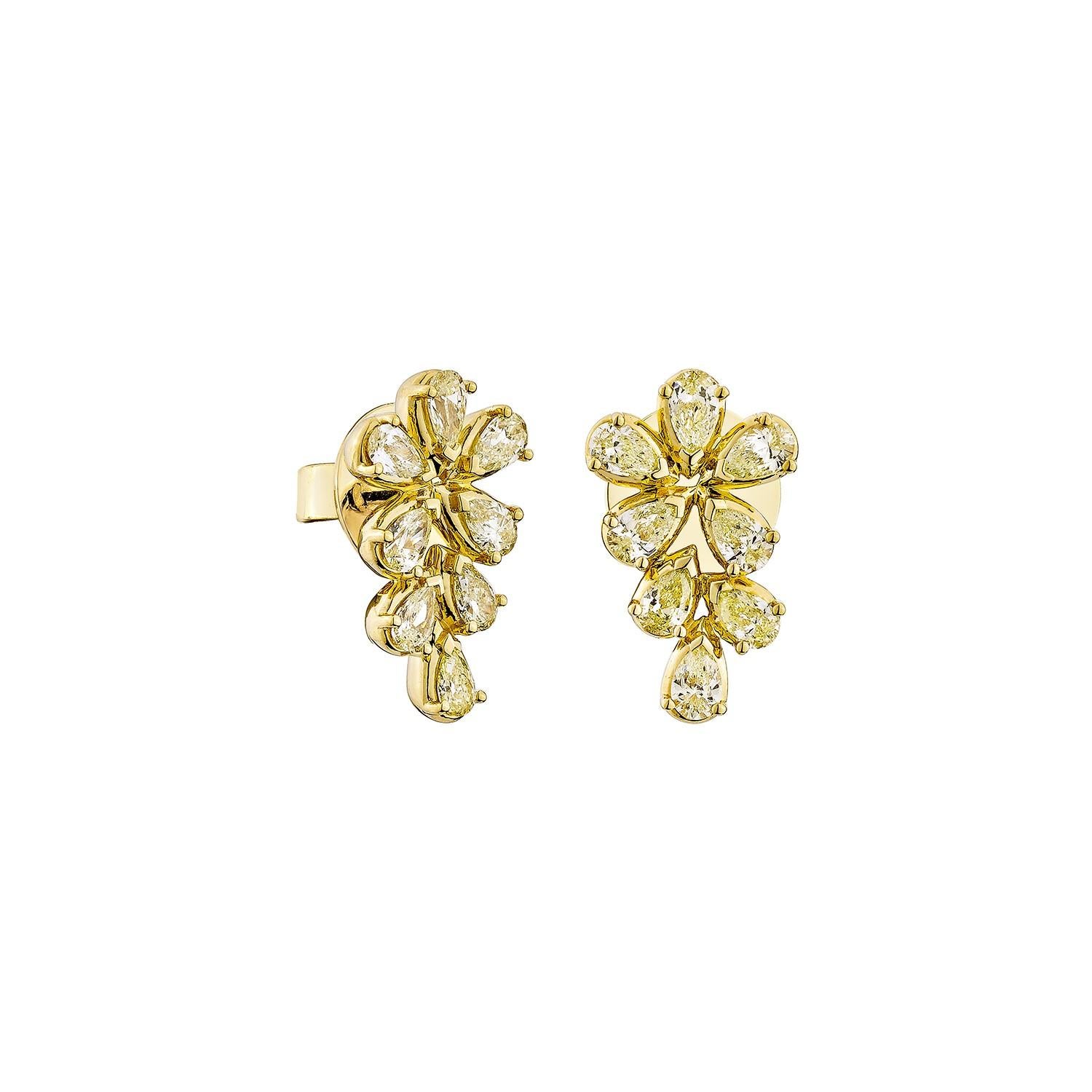 These stunning earrings feature an artistic cluster of pear-shaped diamonds arranged in a floral, cascading design. Set in rich 18K yellow gold, they offer brilliant sparkle and a refined silhouette—perfect for adding timeless elegance to any