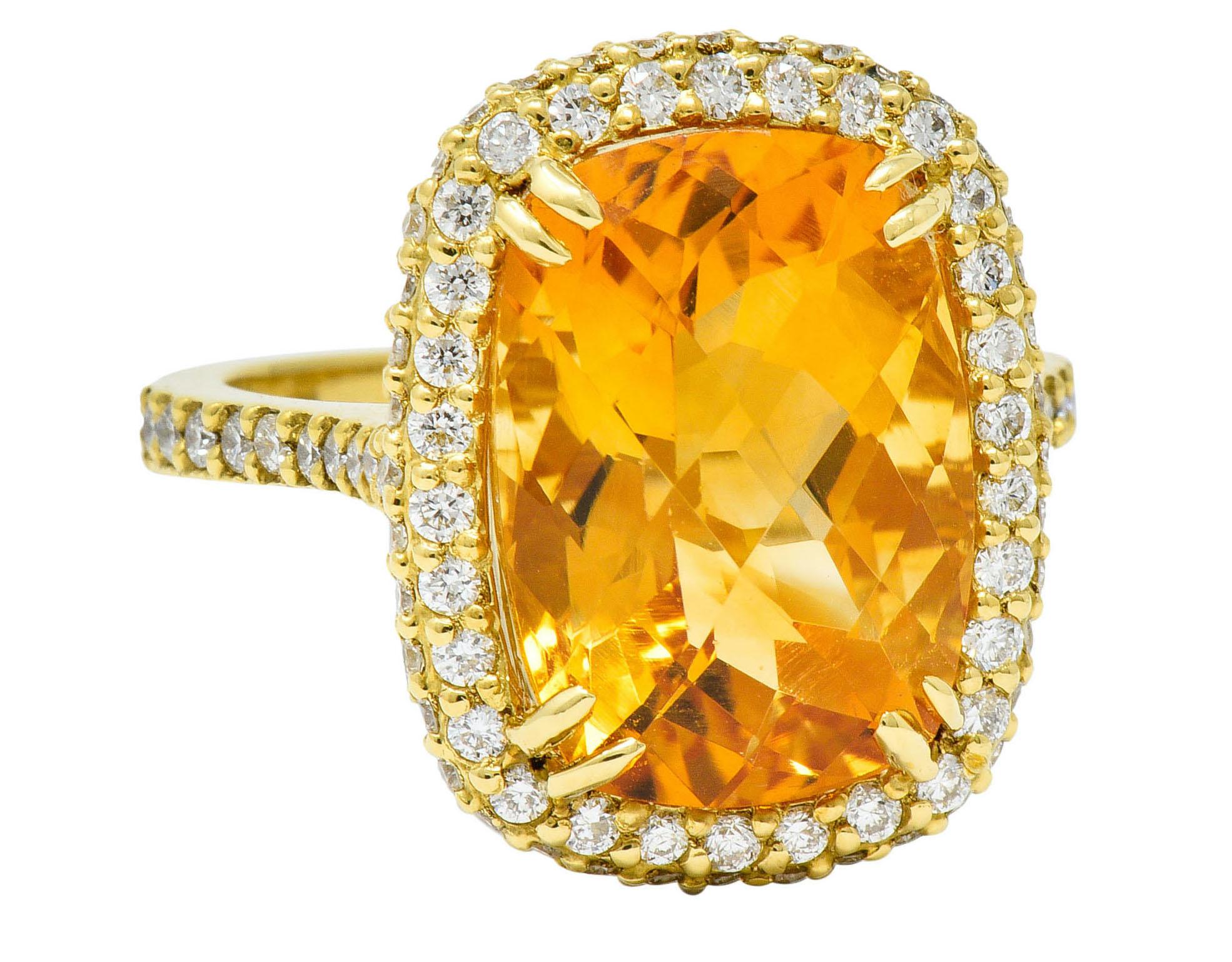 Centering a rectangular checkerboard cut citrine measuring approximately 14.0 x 10.0 mm

A saturated yellowish-orange color and set with split prongs in a stylized floral basket

Surrounded by a round brilliant cut diamond pavè halo and shoulders,