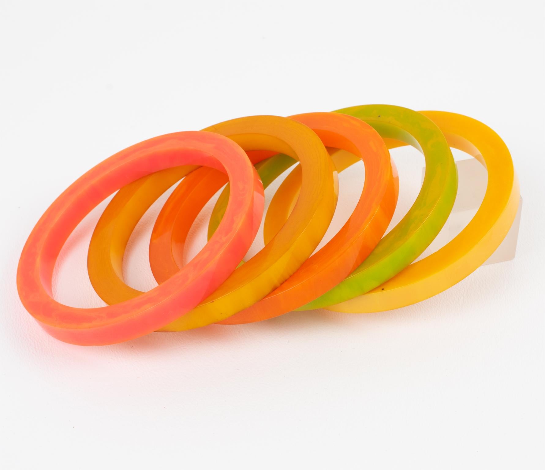So cool Bakelite bracelet bangle, set of five pieces. Chunky spacer sliced shape with bright sunny colors. Assorted tones of green pepper cheese marble, pink tequila sunrise marble, orange mango marble, yellow lemon drop marble, and curry orange.