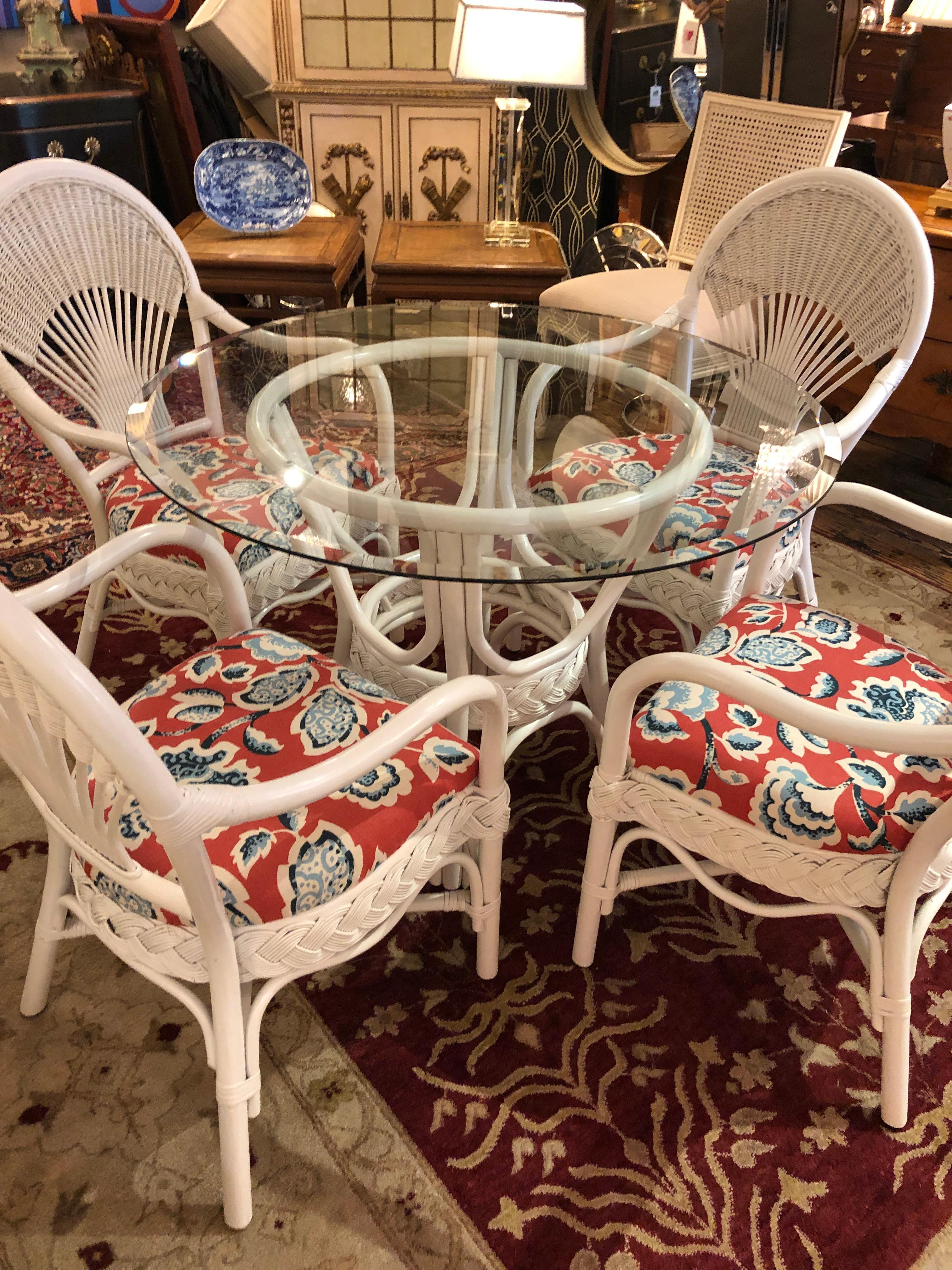 Summery versatile white wicker round dining table and chair set having bevelled round glass top table and four comfortable Classic fan back arm chairs upholstered in lively red, white and blue fabric. Pour the lemonade!
Perfect for a