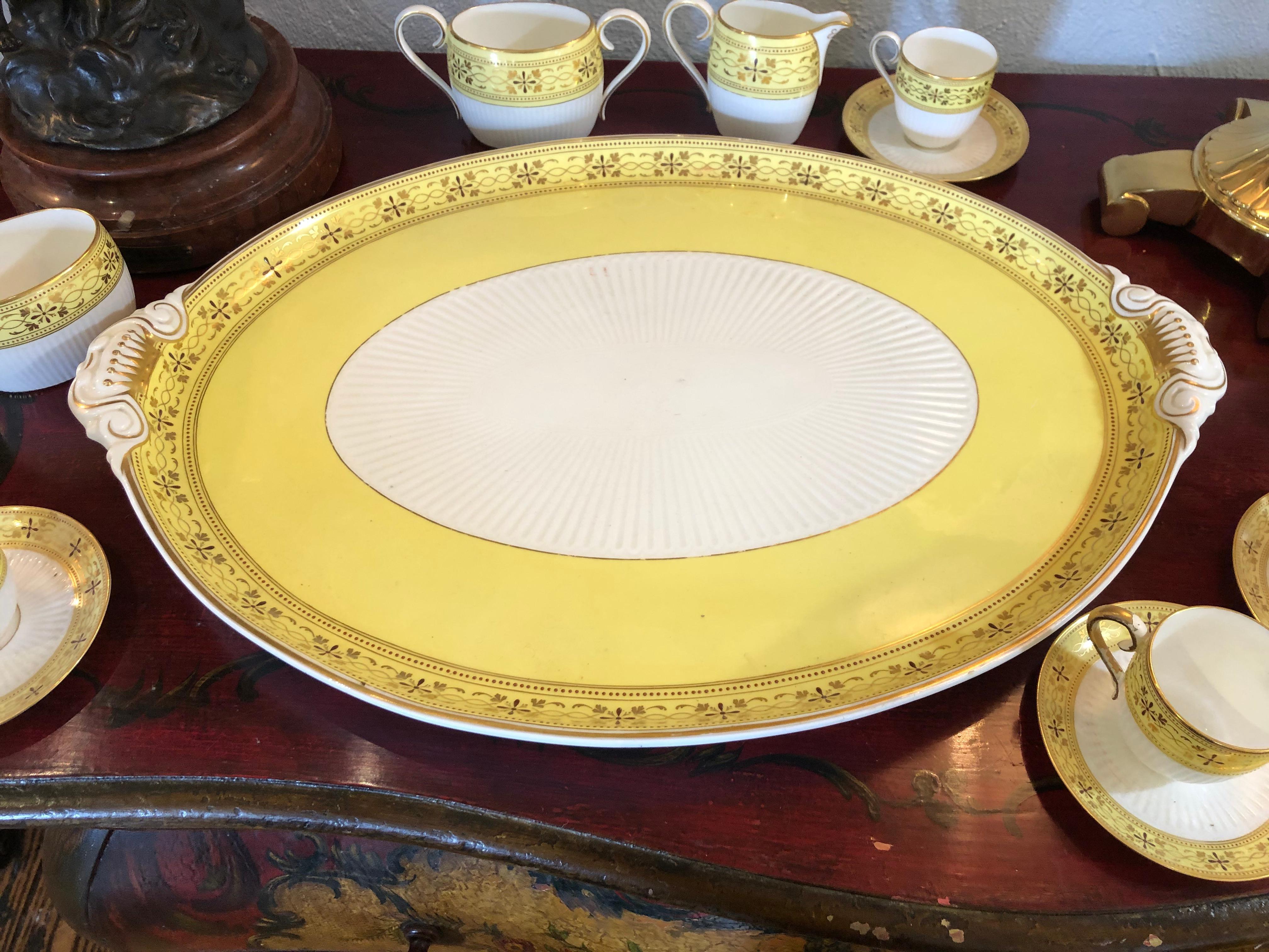 An eye-catching lovely large set of Bailey Banks and Biddle tea set in a happy yellow and white and gold leaf.
Includes 5 cups and saucers, tea pot, sugar bowl and creamer. One extra oval bowl with no lid.
Measures: Tray 21.5 width x 16 depth x