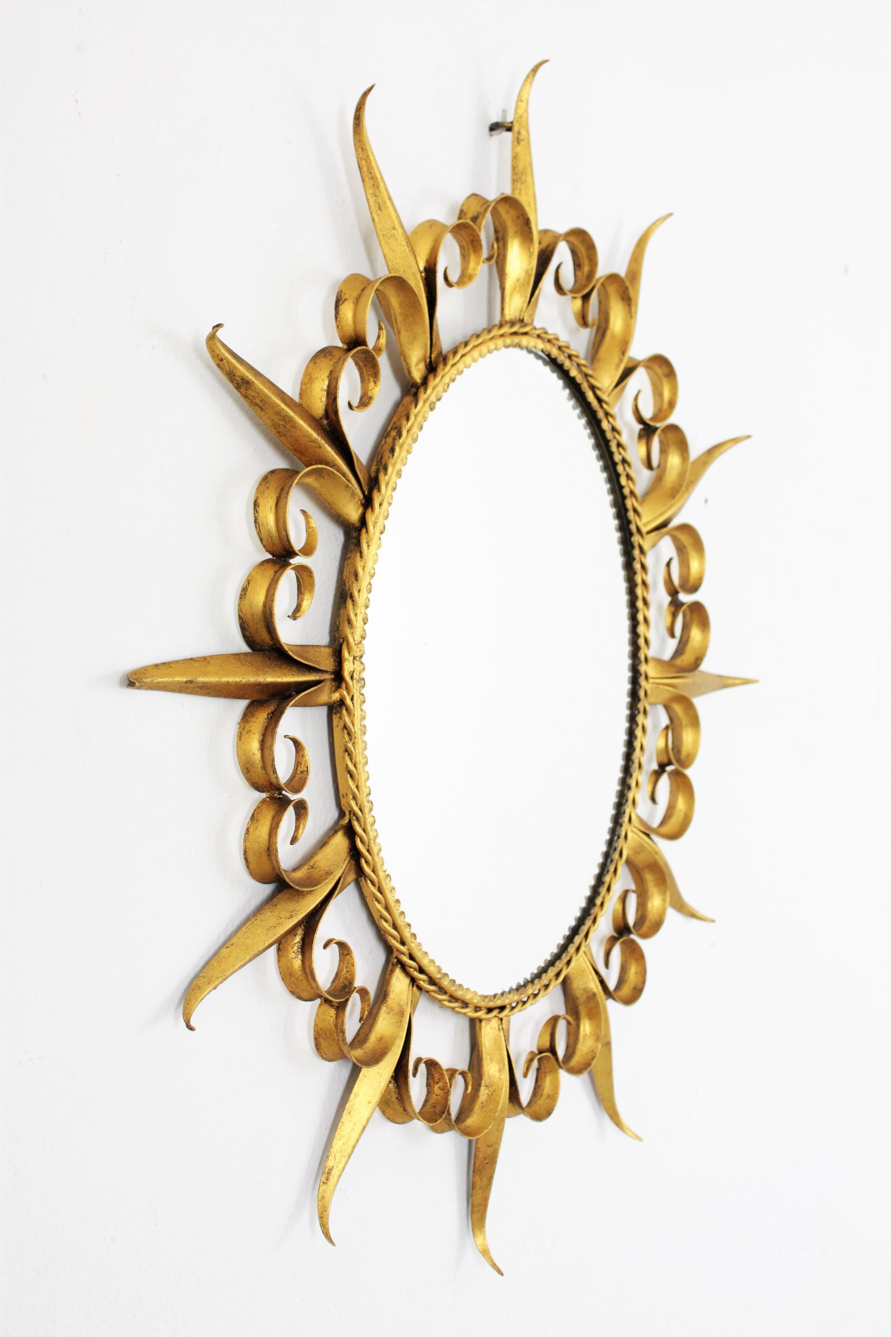 20th Century Sunburst Eyelash Oval Mirror in Gilt Wrought Iron For Sale