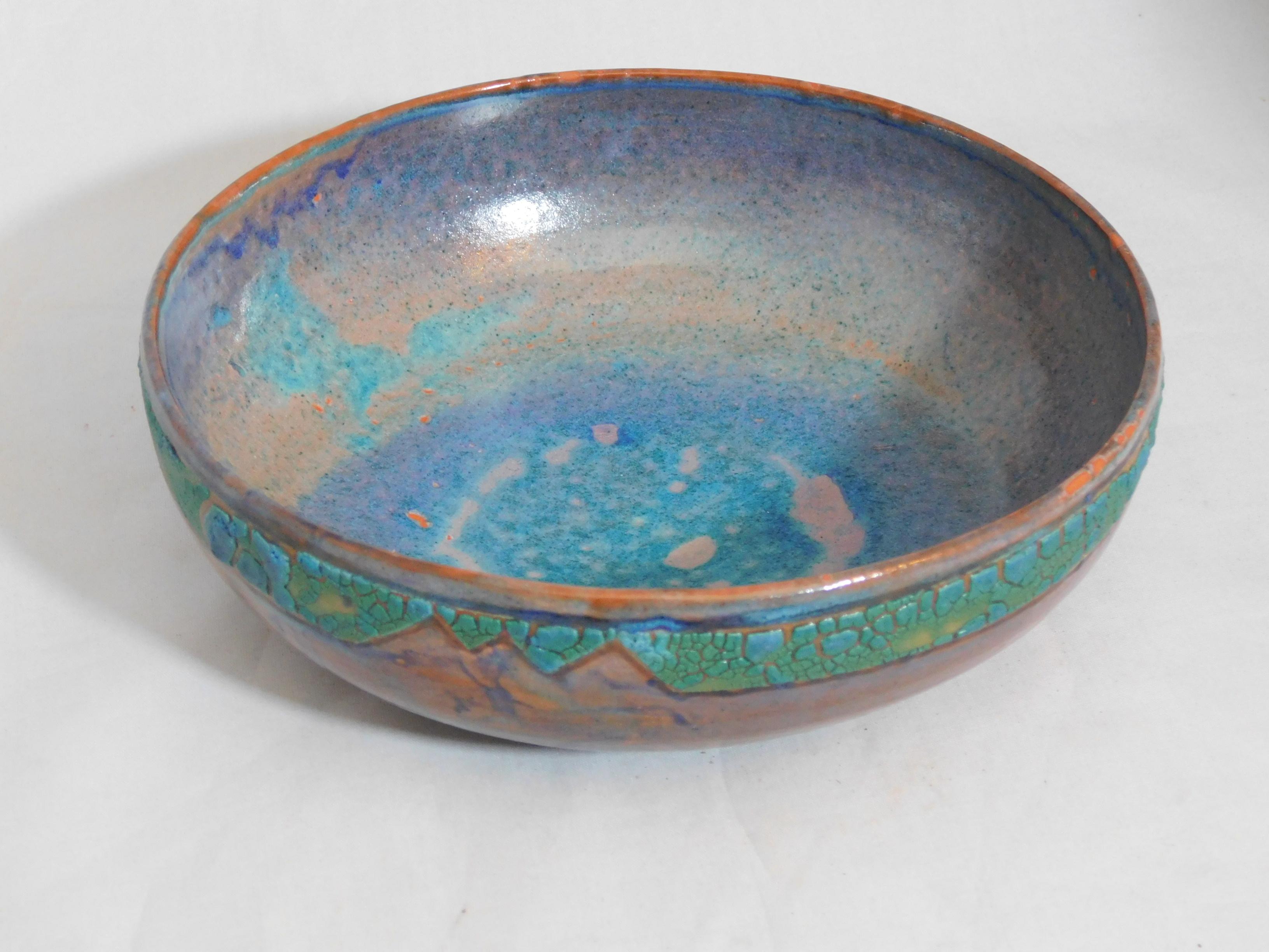 Wheel thrown sunset plaza earthenware bowl by ceramicist Andrew Wilder. This is a one of a kind object made in the ancient way- by hand in a small artisanal pottery. In this series Wilder explores the application of lichen under glazes to achieve