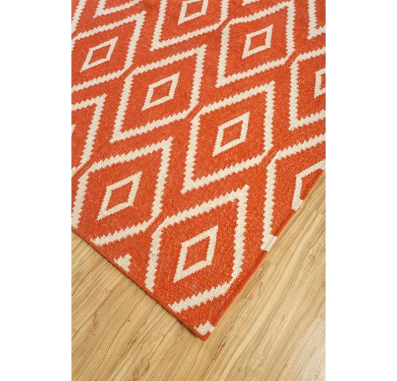 What whispers of creativity and cultural resonance inspired the vibrant design of this handcrafted rug? Welcome to the realm of modern elegance, where geometric patterns dance with finesse. Handmade in the rural heartlands of India, each thread