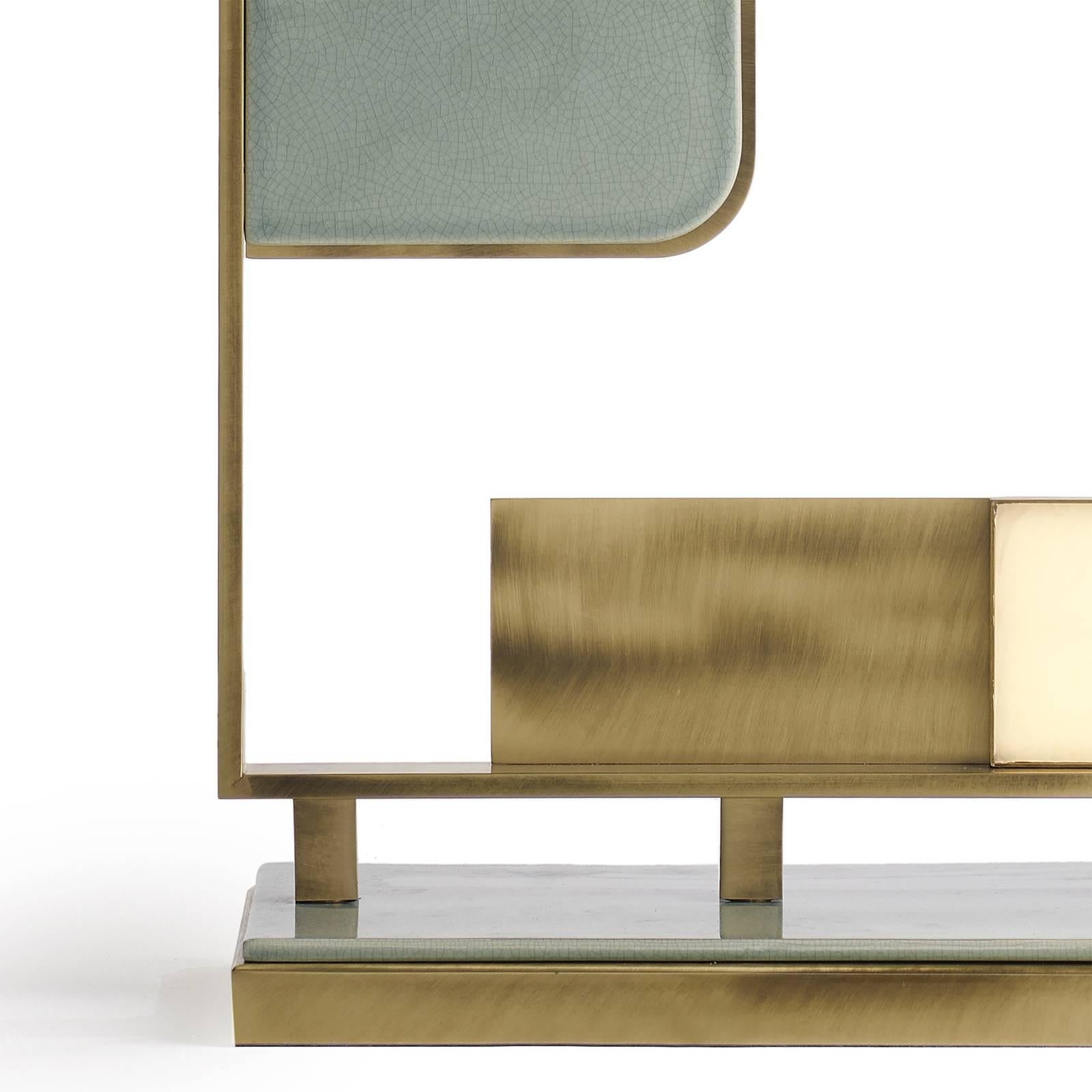 An eye-catching addition to a contemporary or modern decor, this tall table lamp is a unique piece off functional decor that provides a room with light, coming from OLED by LG panels, and an exquisite decoration, thanks to its brushed brass