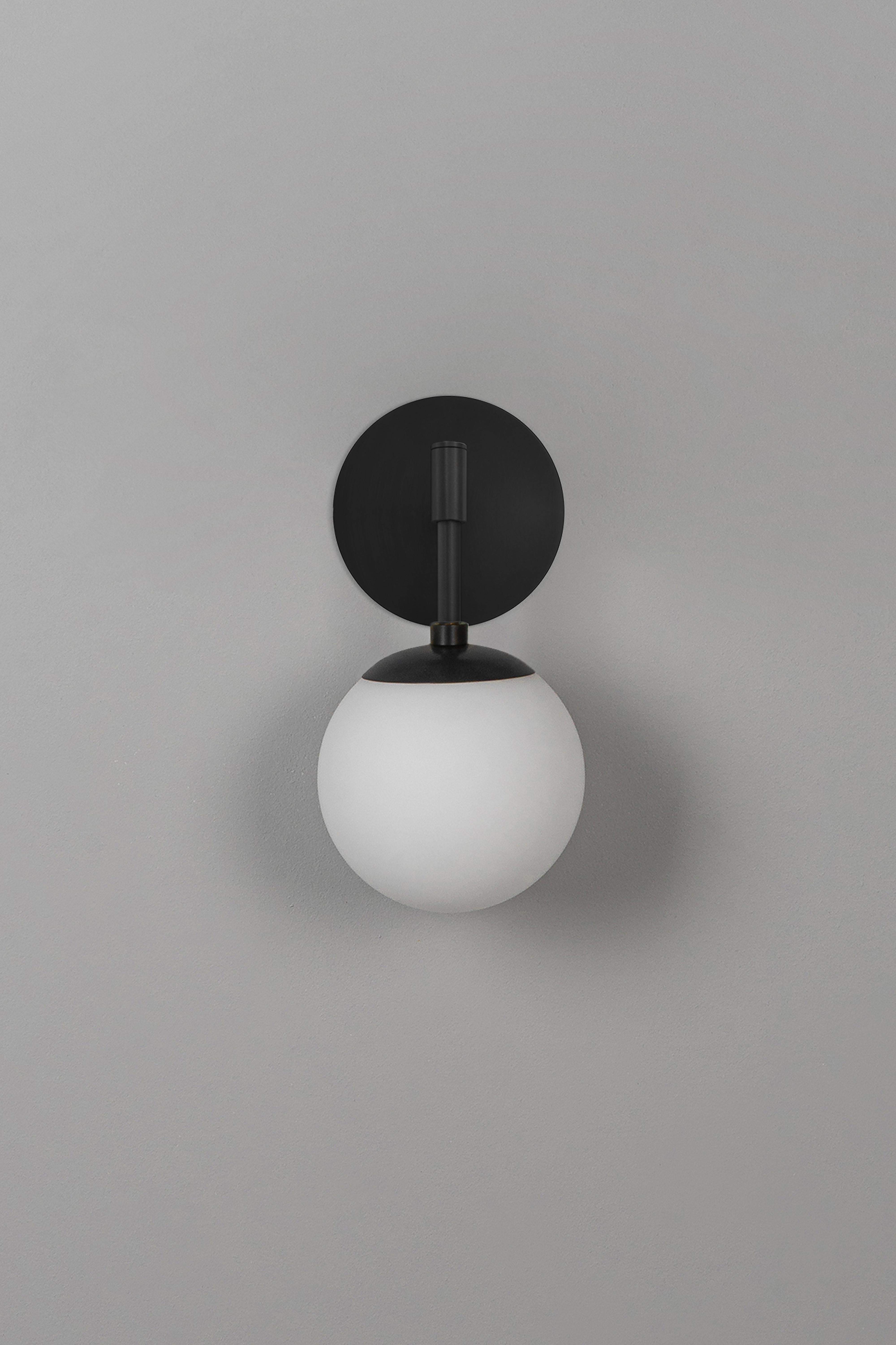 Sunset wall sconce by Schwung
Dimensions: W 15 x D 16.1 x H 31 cm
Materials: black gunmetal, frosted glass.
All our lamps can be wired according to each country. If sold to the USA it will be wired for the USA for instance.

 Schwung is a