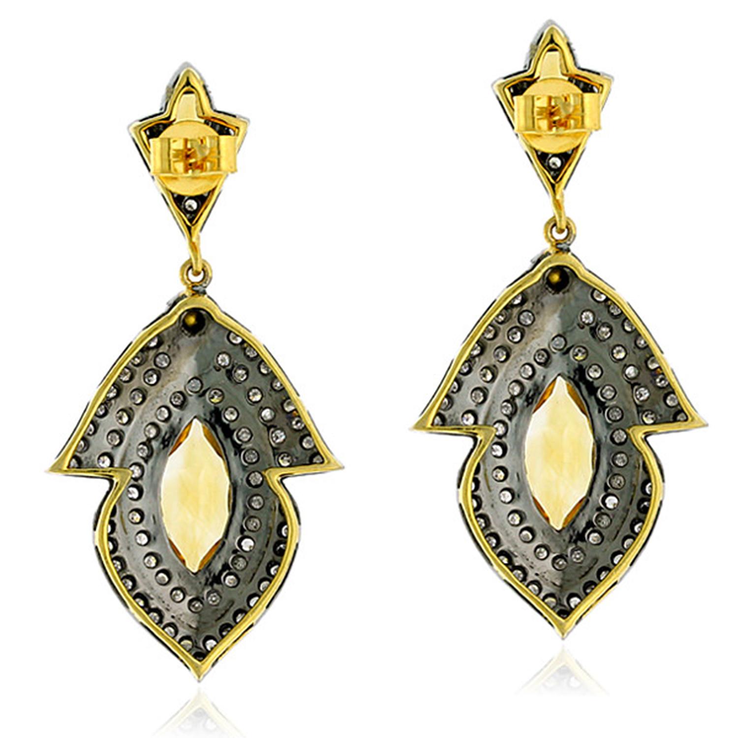 Sunshine Citrine and Diamond drop Earring in silver and 18K Gold is perfect for summers.

Closure; Push Post

18kt Gold: 3.29gms
Diamond: 2.41cts
Silver: 8.92gms
Citrine: 4.19cts
