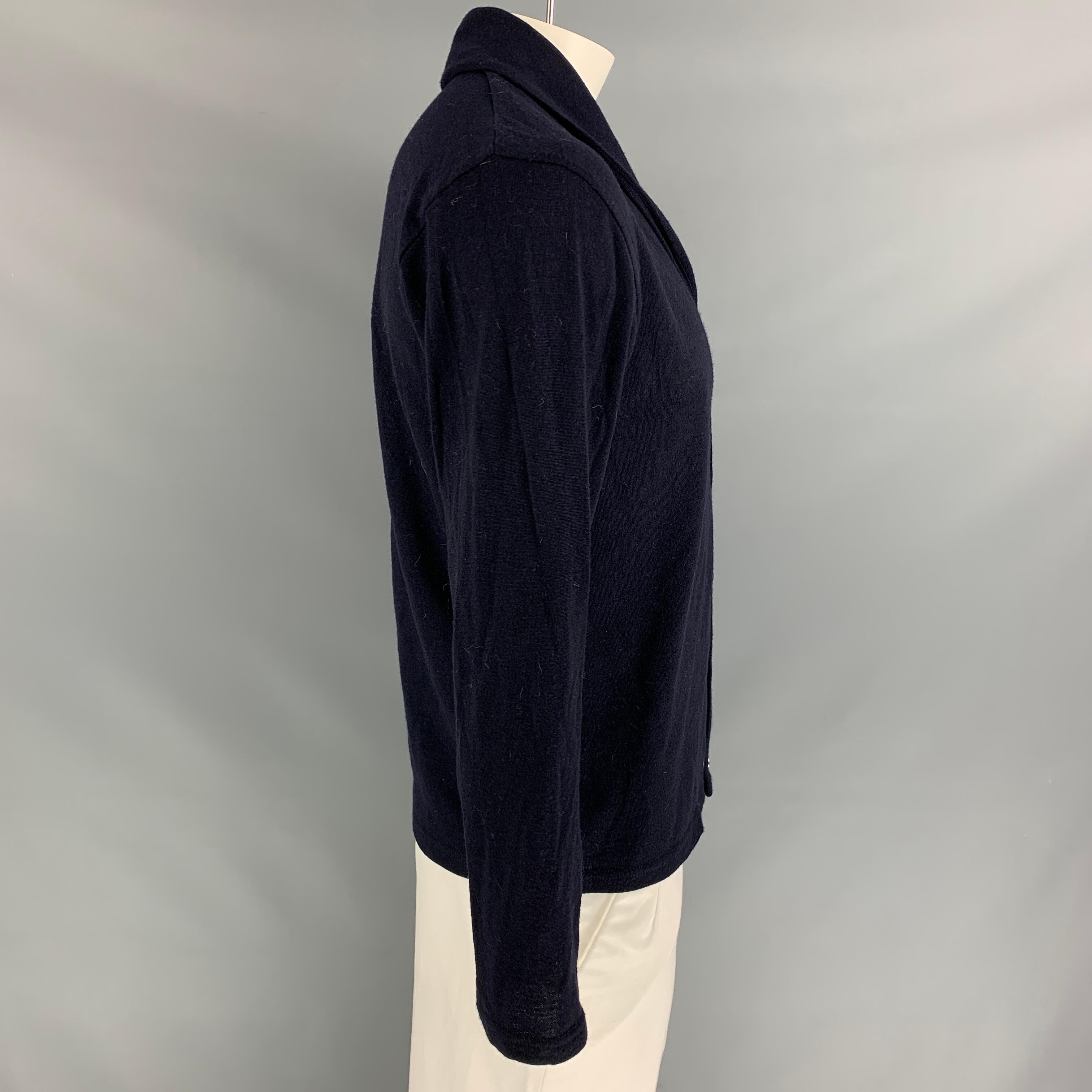 SUNSPEL cardigan comes in a navy knitted wool featuring a shawl collar and a buttoned closure. Made in England. 

Very Good Pre-Owned Condition.
Marked: L

Measurements:

Shoulder: 18 in.
Chest: 44 in.
Sleeve: 24 in.
Length: 26 in. 