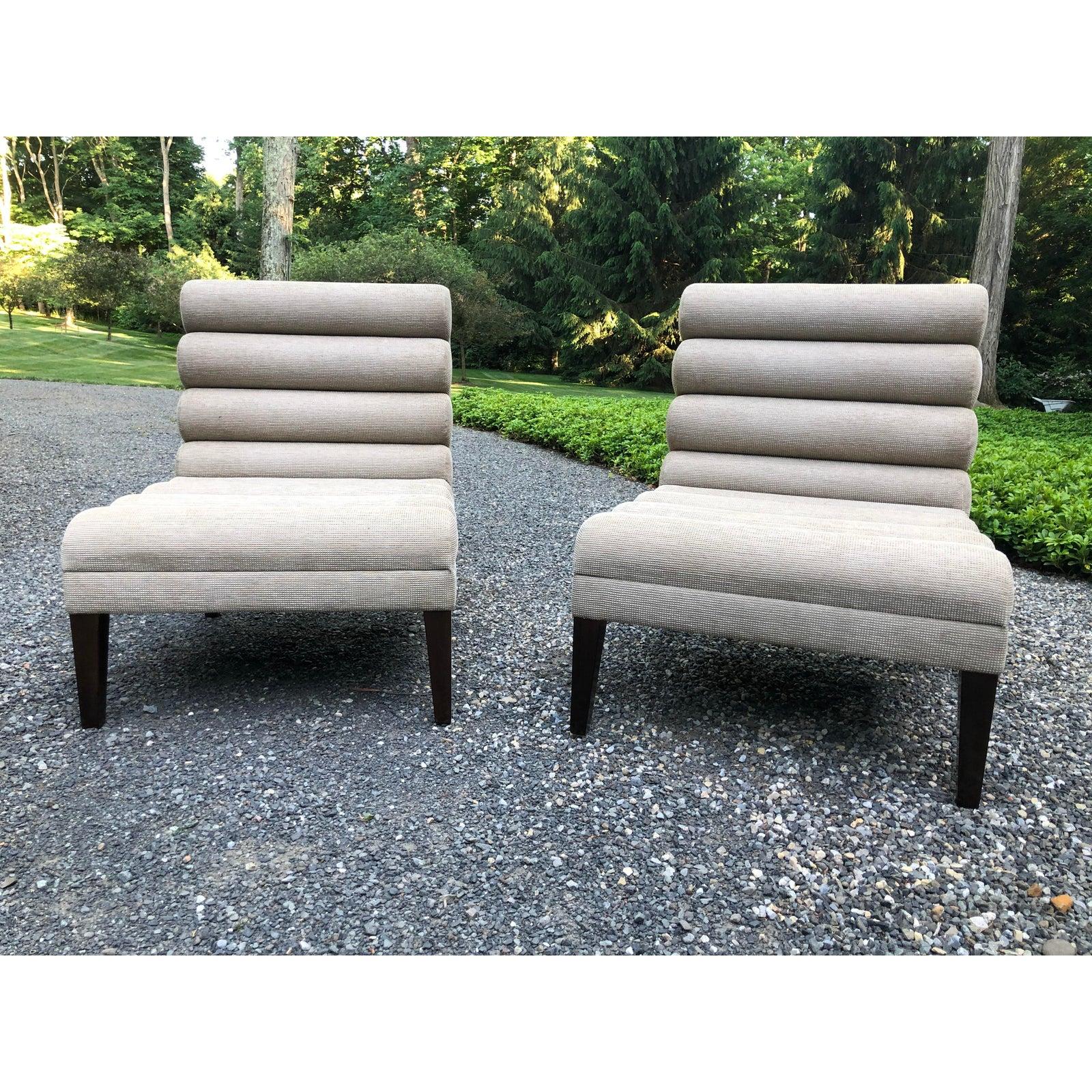 Very chic pair of Mid-Century Modern slipper chairs having a neutral textured light taupe upholstery and ebonized legs.