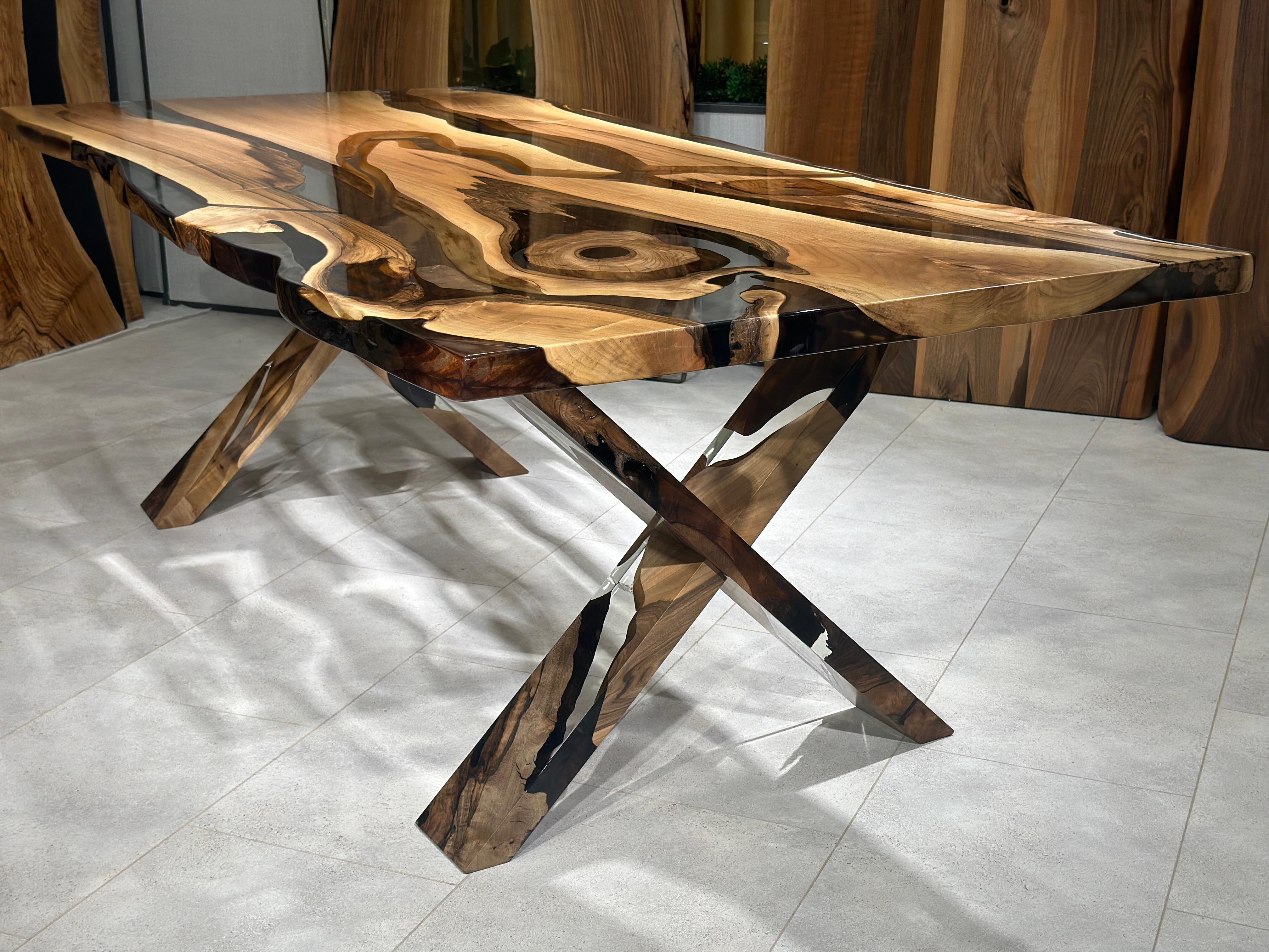 Black Walnut Ultra Clear Epoxy Resin Dining Table 

This table is made of 500 years old Walnut Wood. The grains and texture of the wood describe what a natural walnut woods looks like.
It can be used as a dining table or as a conference table.