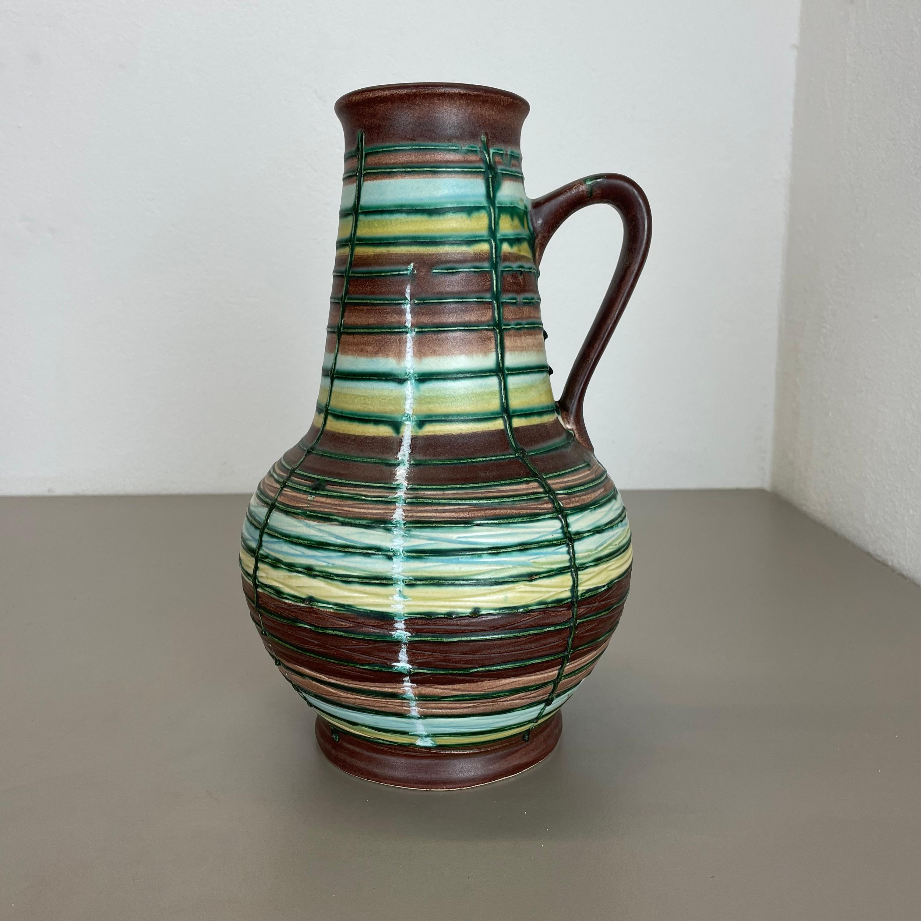 Article:

Pottery ceramic vase


Producer:

BAY Ceramic, Germany



Decade:

1970s



Description:

Original vintage 1970s pottery ceramic vase made in Germany. High quality German production with a nice abstract painting and super colorful surface.