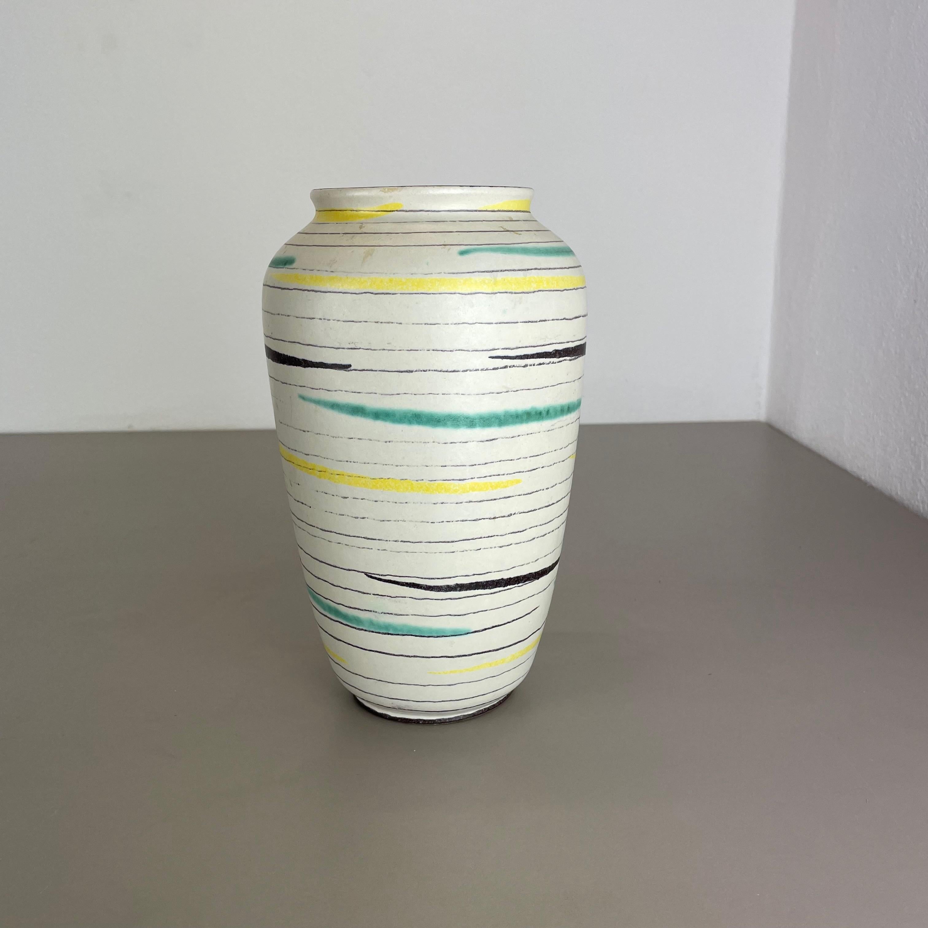 Article:

Pottery ceramic vase


Producer:

BAY Ceramic, Germany



Decade:

1950s




Original vintage 1970s pottery ceramic vase made in Germany. High quality German production with a nice abstract painting and super colorful