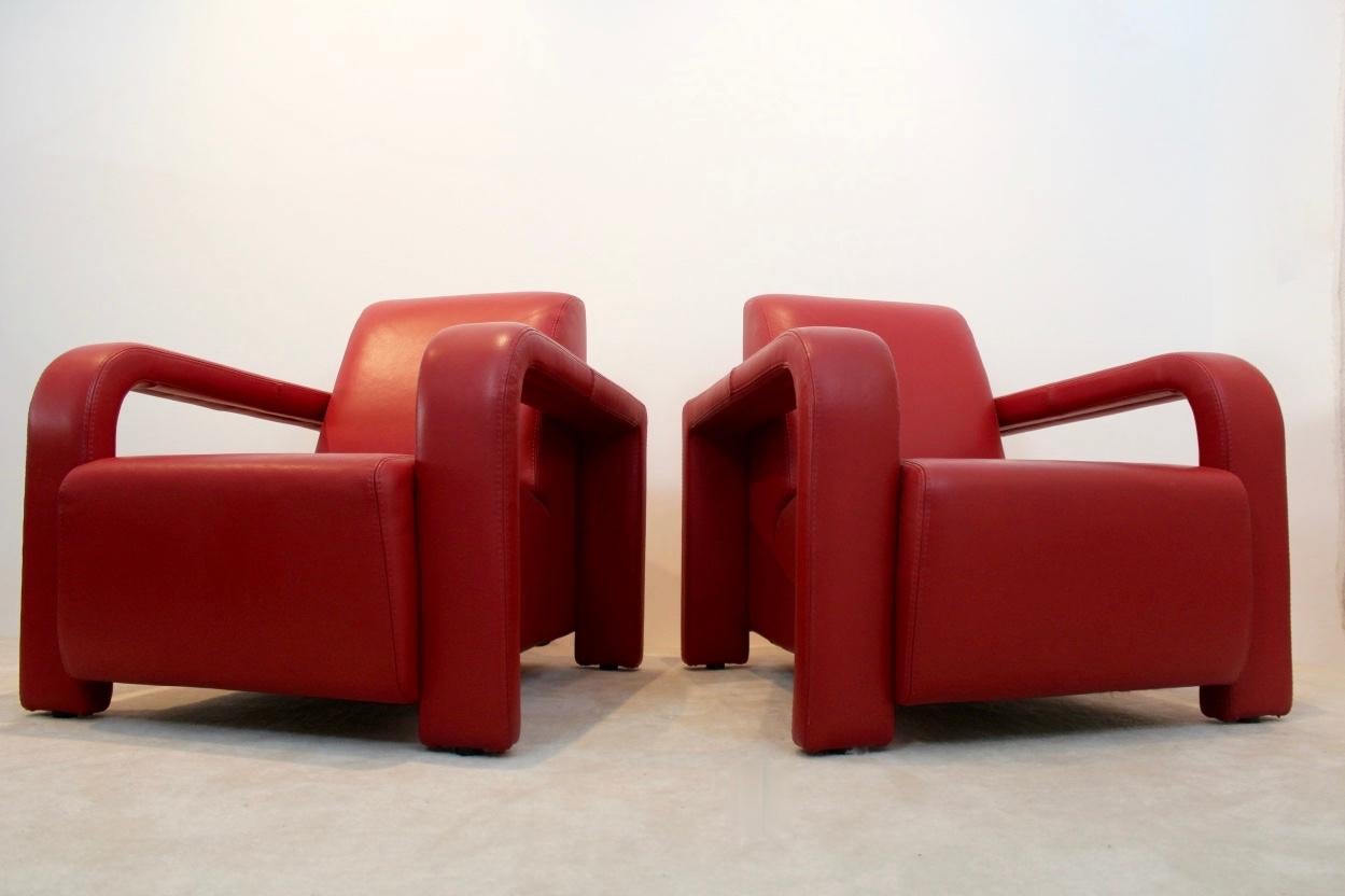 Super set of two Italian red leather armchairs manufactured by Marinelli of Italy. These lounge chairs are extremely comfortable to sit in. The set has a very solid frame and original upholstery in really beautiful leather, signed 