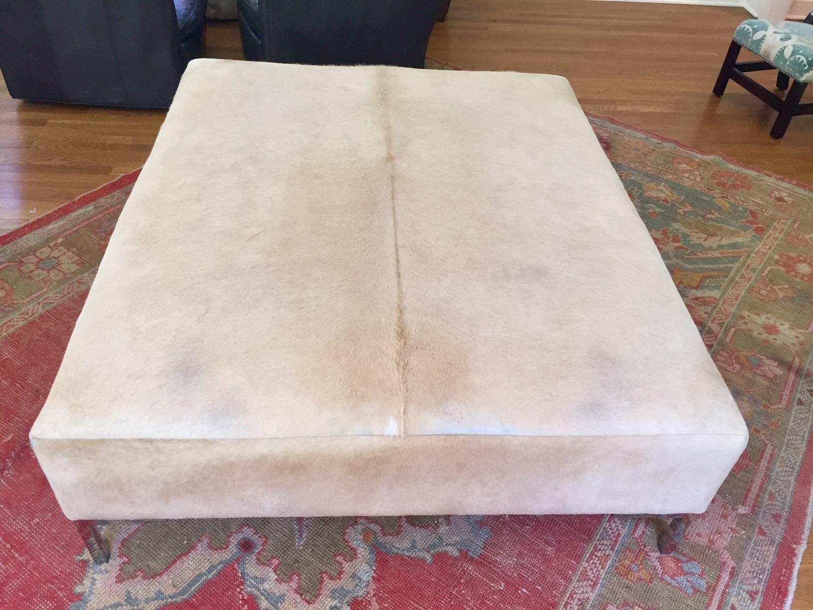 Natural tan cow hide with solid stainless modern legs.
Firm enough for seating or to be used for serving food/drinks.
Some wear along edge seems. 
Plantation custom made furniture. Purchase in 2012. 
