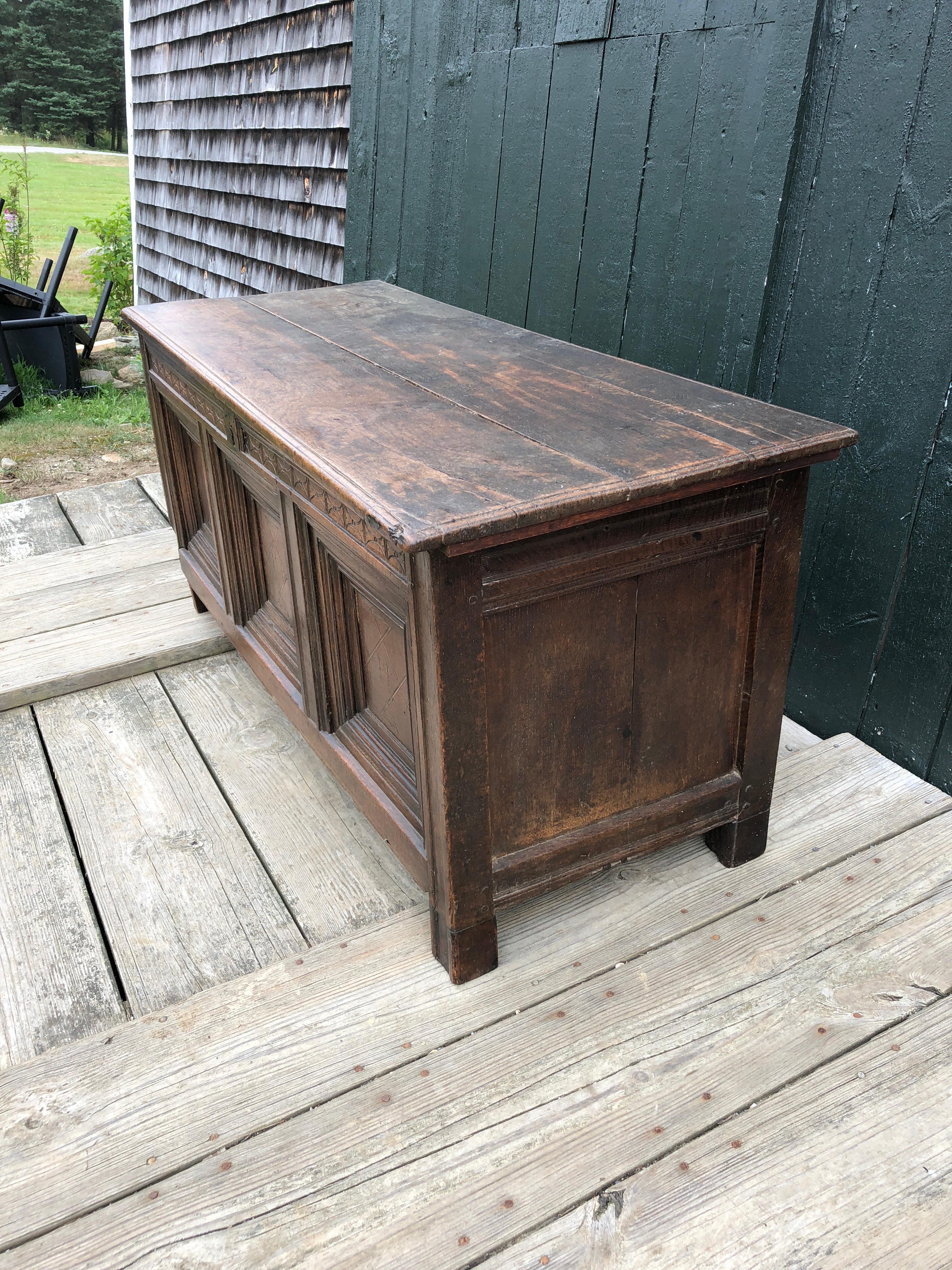 Very early British plank-top coffer of good color, with the original date of 1591. Inlaid detail within paneling below beautifully carved frieze including the initials E and H.

Interior 19.5 H x 18.5 D.