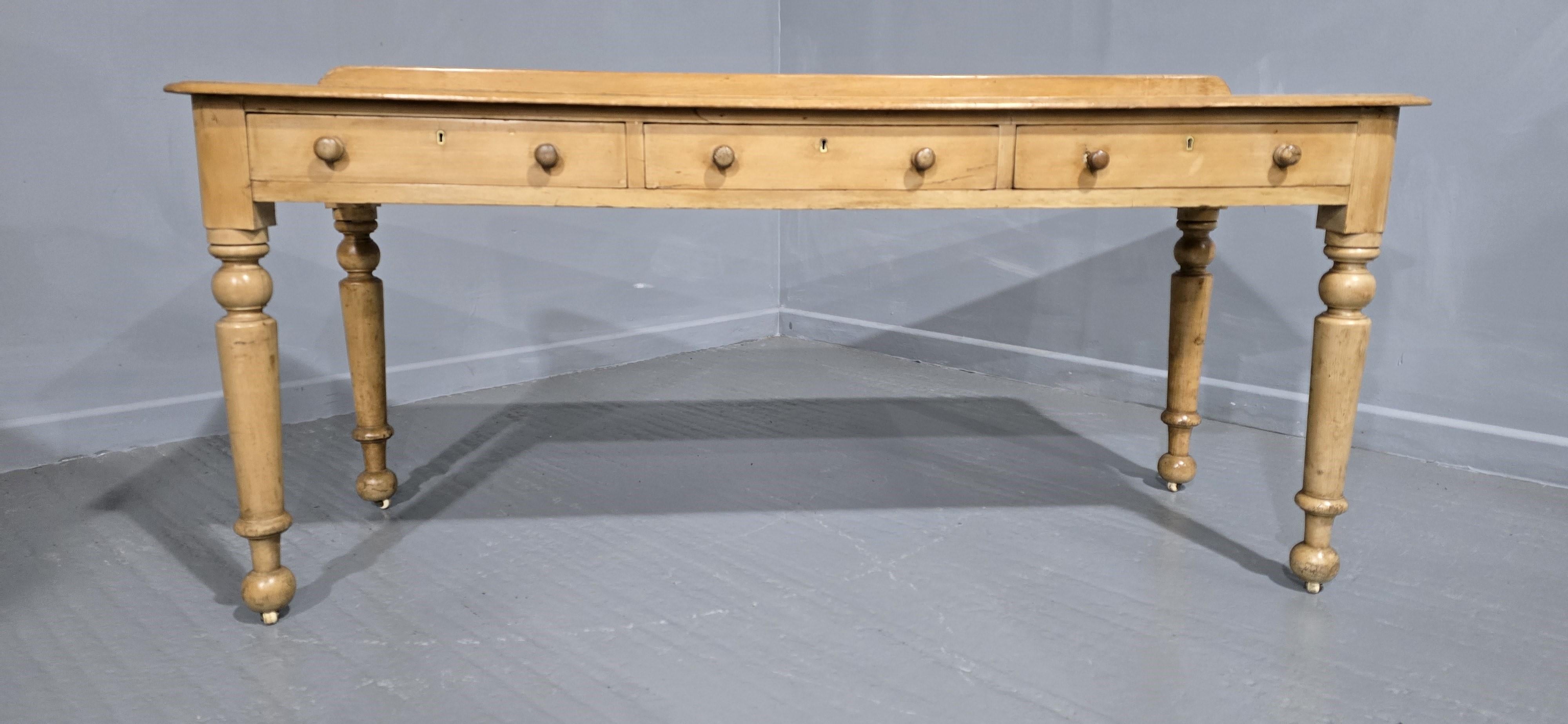 Excellent Early Victorian three drawer pine console, kitchen  or hall table, inset white porcelain castors, in excellent overall original condition.

31.5