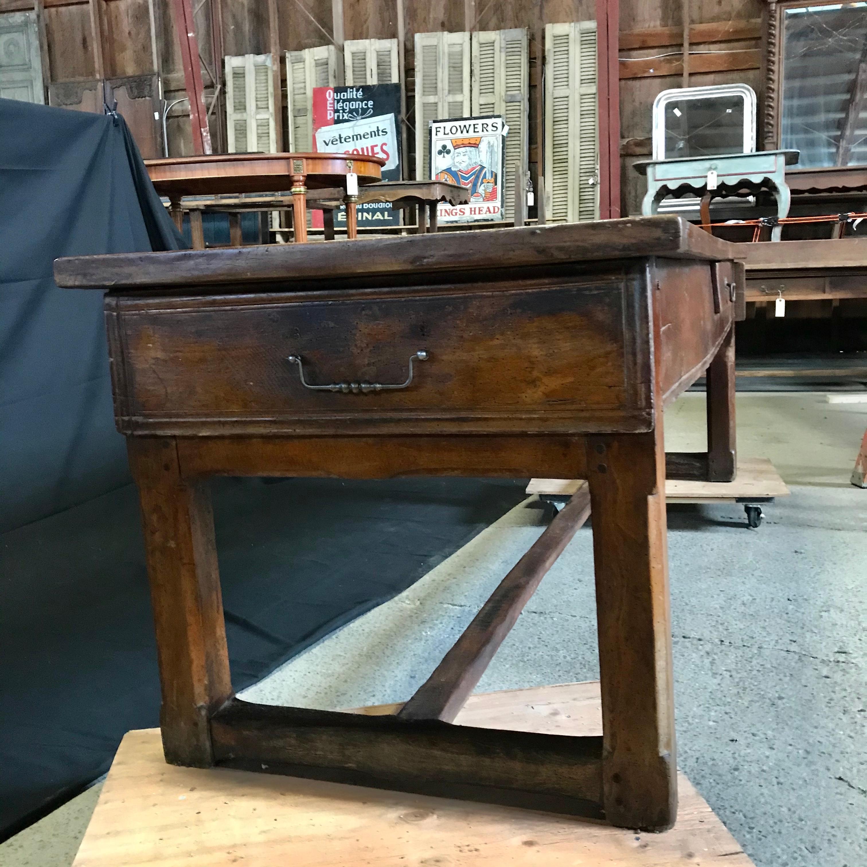 A wonderful 18th century antique large and substantial walnut French country farmhouse table with two roomy end drawers and one interior drawer. Wonderful refectory style legs and authentic original joinery. 

H skirt 21 
#4819.