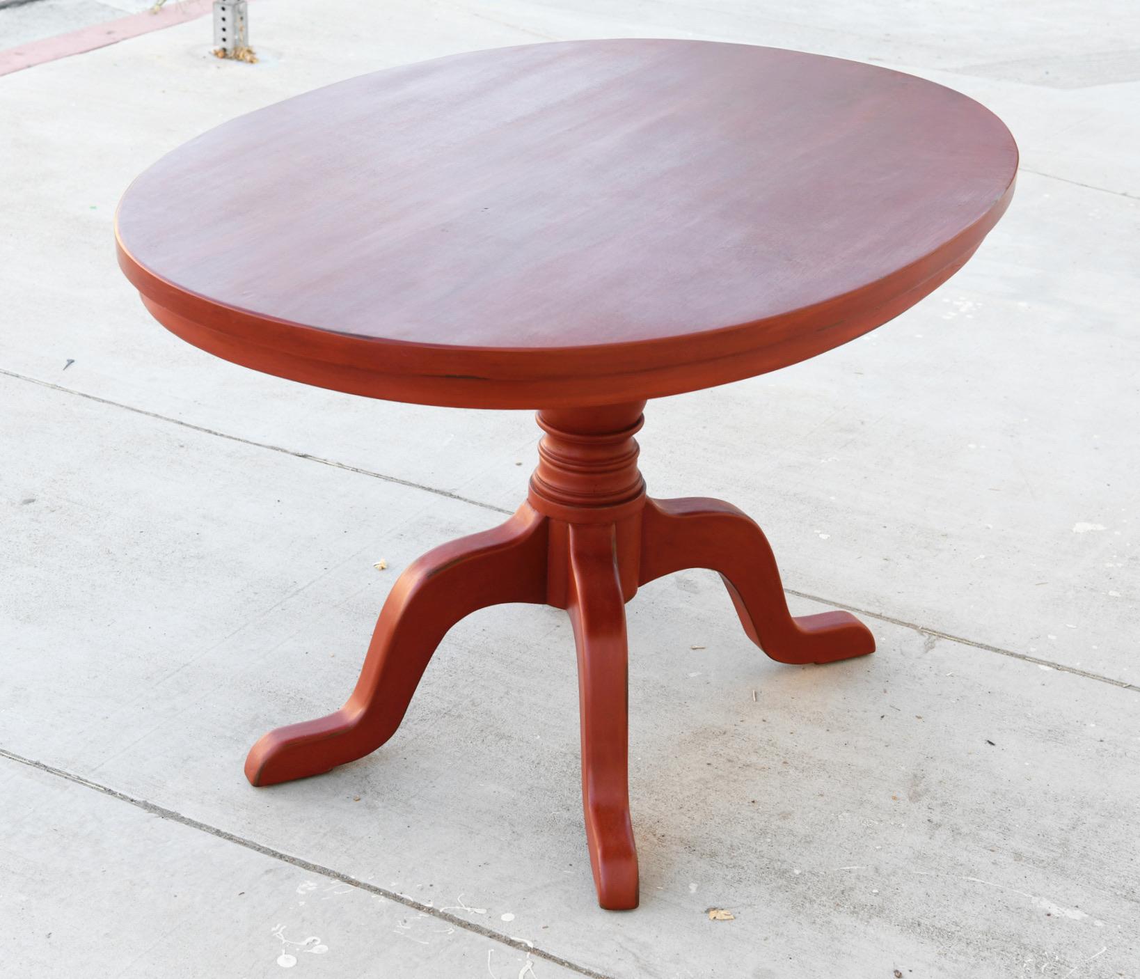 This custom painted pedestal table is seen here with a super ellipse top in 48