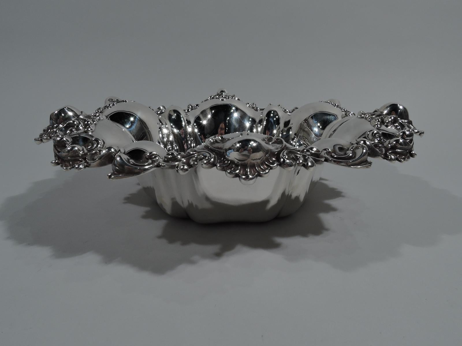Super fancy sterling silver bowl. Made by Meriden Britannia (part of International) in Meriden, Conn., ca 1900. Lobed well and wavy rim with applied scrolls and leaves. Tactile with nice heft. Fully marked and numbered C2875. Heavy weight: 20 troy
