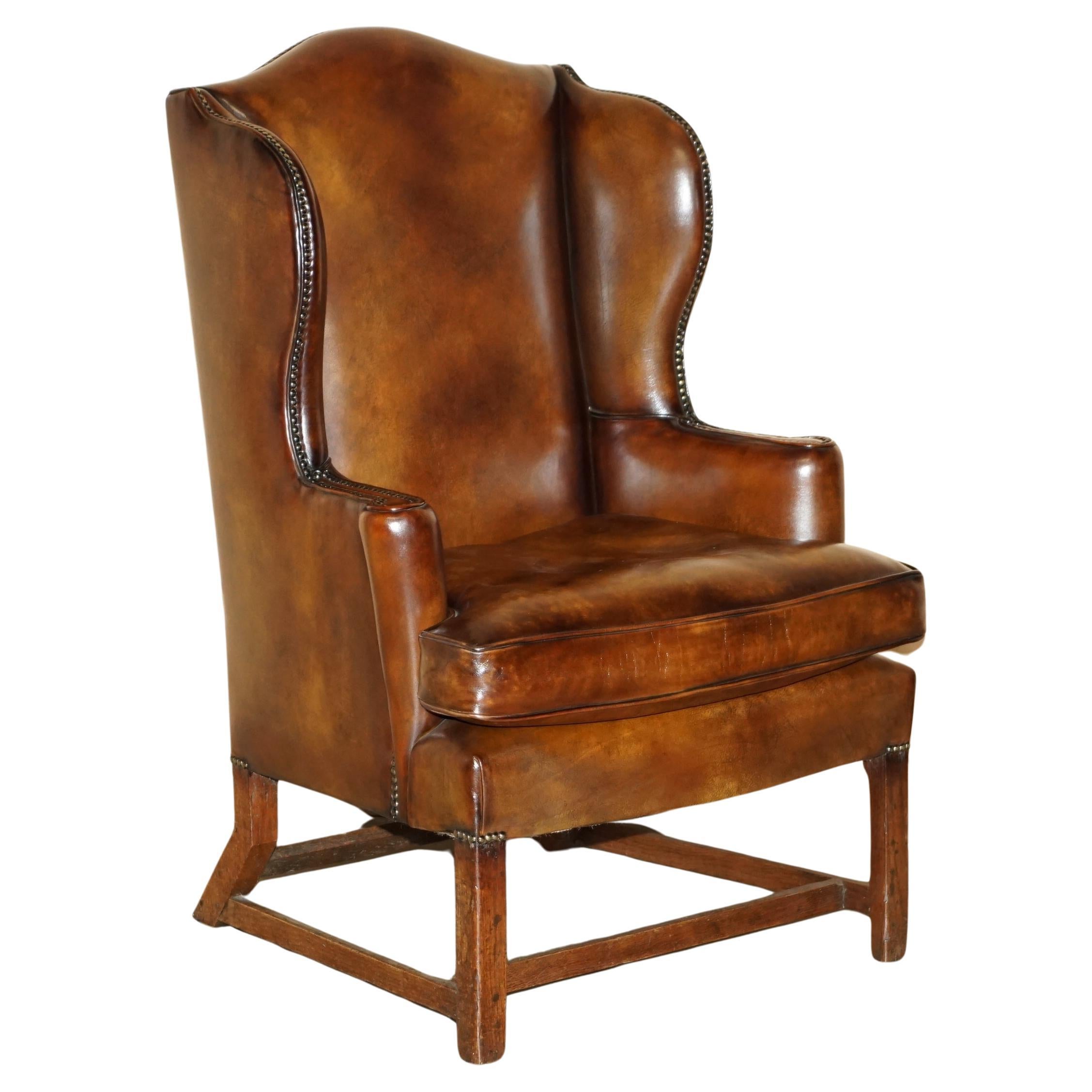 SUPER FINE RESTORED GEORGE III PERIOD CIRCA 1820 WiNGBACK BROWN LEATHER ARMCHAIR For Sale
