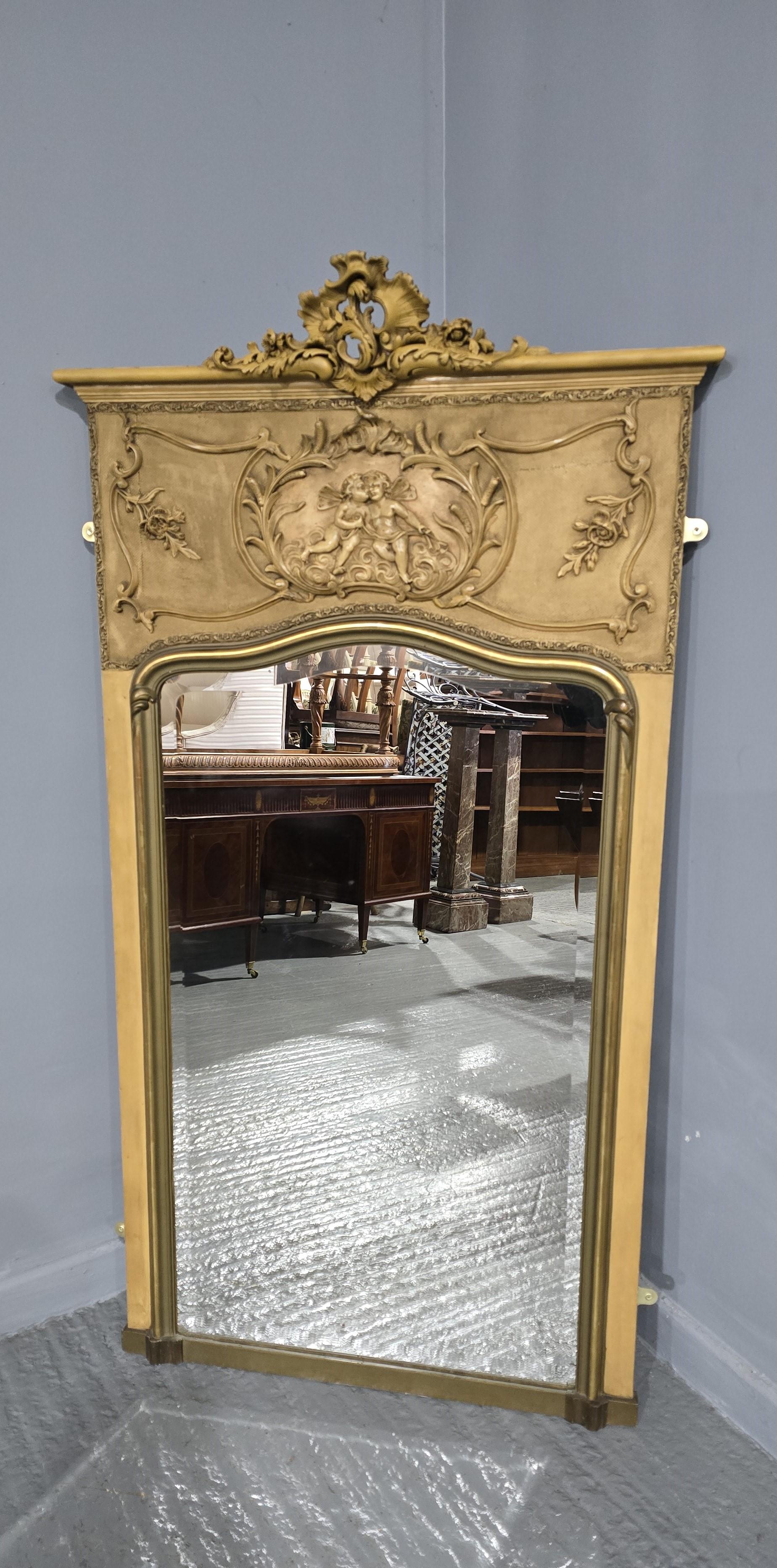 A very attractive 19th century pier mirror, having original bevelled edge mirror with some foxing in gilded and painted frame with centre crest to the top, all in wonderful home ready condition. c1880 

Height 62