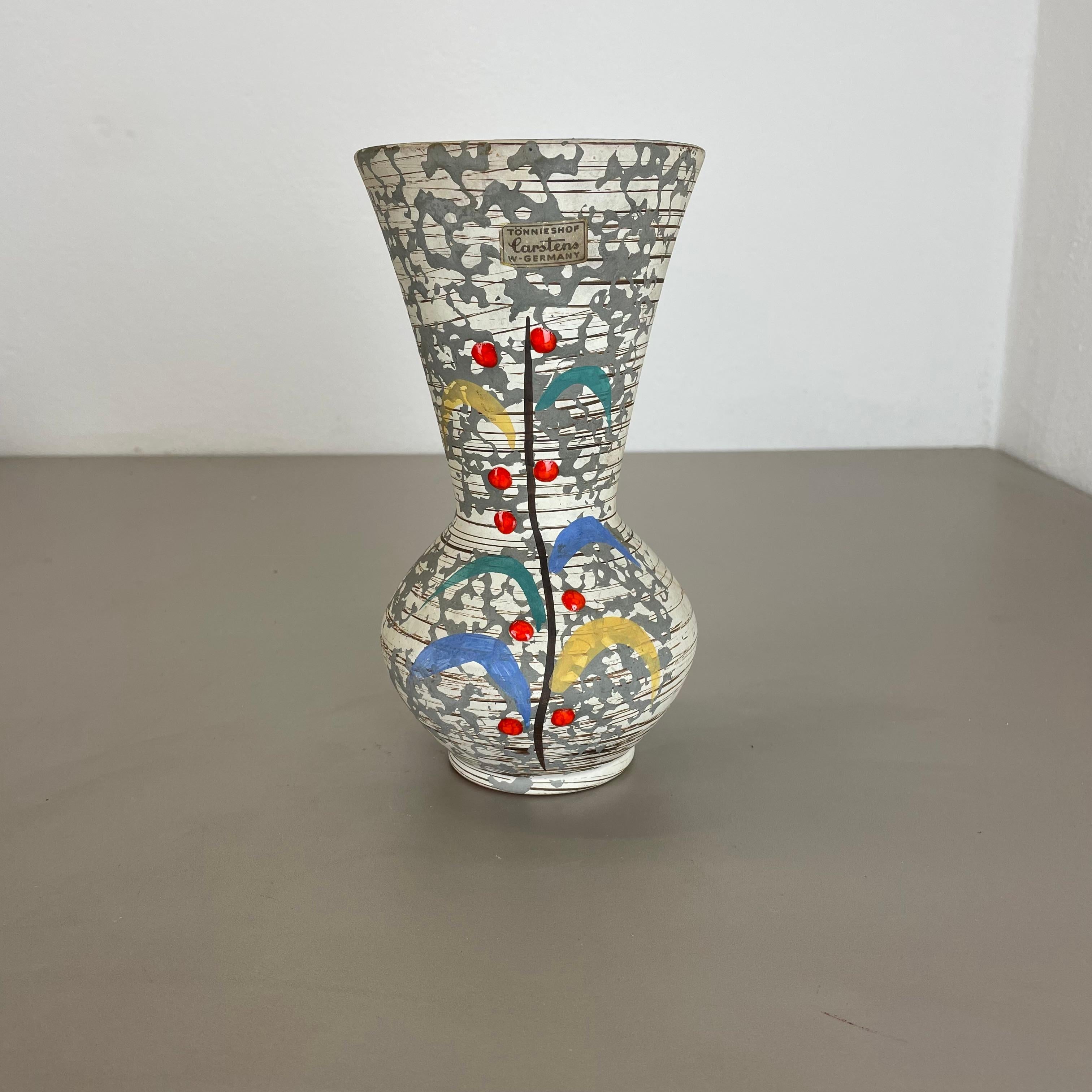 Article:

Ceramic pottery vase


Origin:

Germany



Producer:

Carstens Tönnieshof, Germany


Decade:

1950s


This original vintage pottery object was produced by Cartens Tönnieshof in the 1950s in Germany. It is made of pottery ceramic and has a