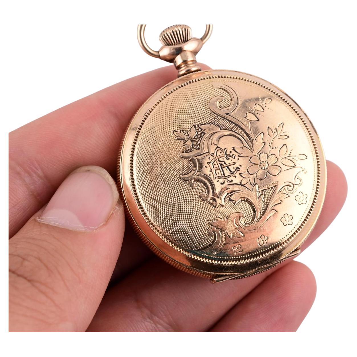 This exquisite Waltham pocket watch is a timeless addition to any collection. Crafted from 14k gold, this round watch showcases intricate floral engravings on its case, adding a touch of elegance and sophistication. The manual movement ensures