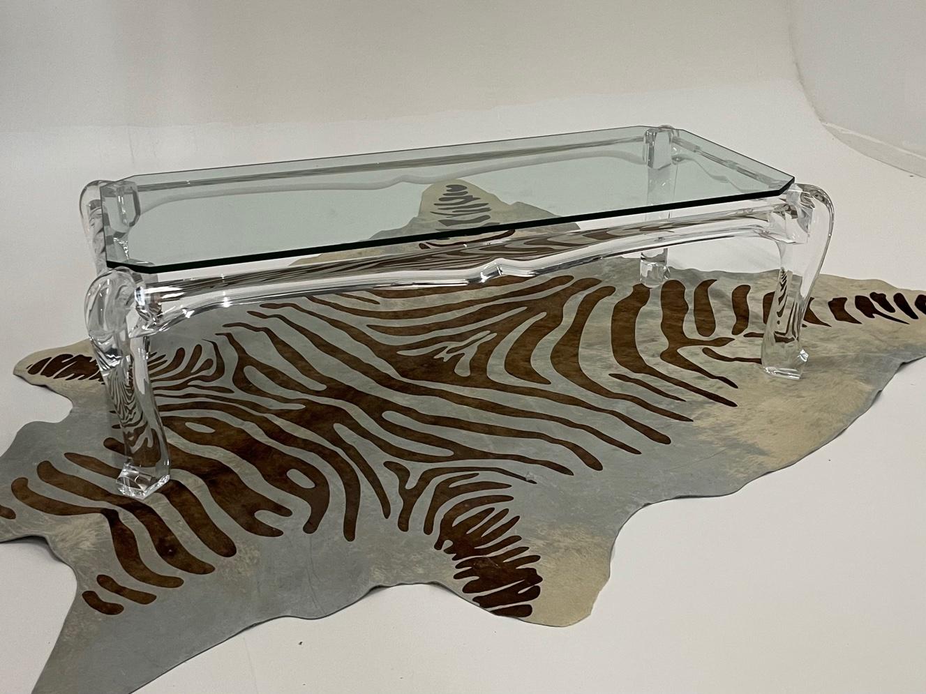 Moviestar glamorous sculptural lucite coffee table having sensational sensual shape, exaggerated cabriole legs and 1/2