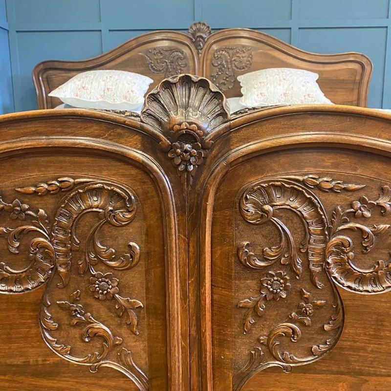 A huge antique French walnut wooden Louis XV bedstead 6'6