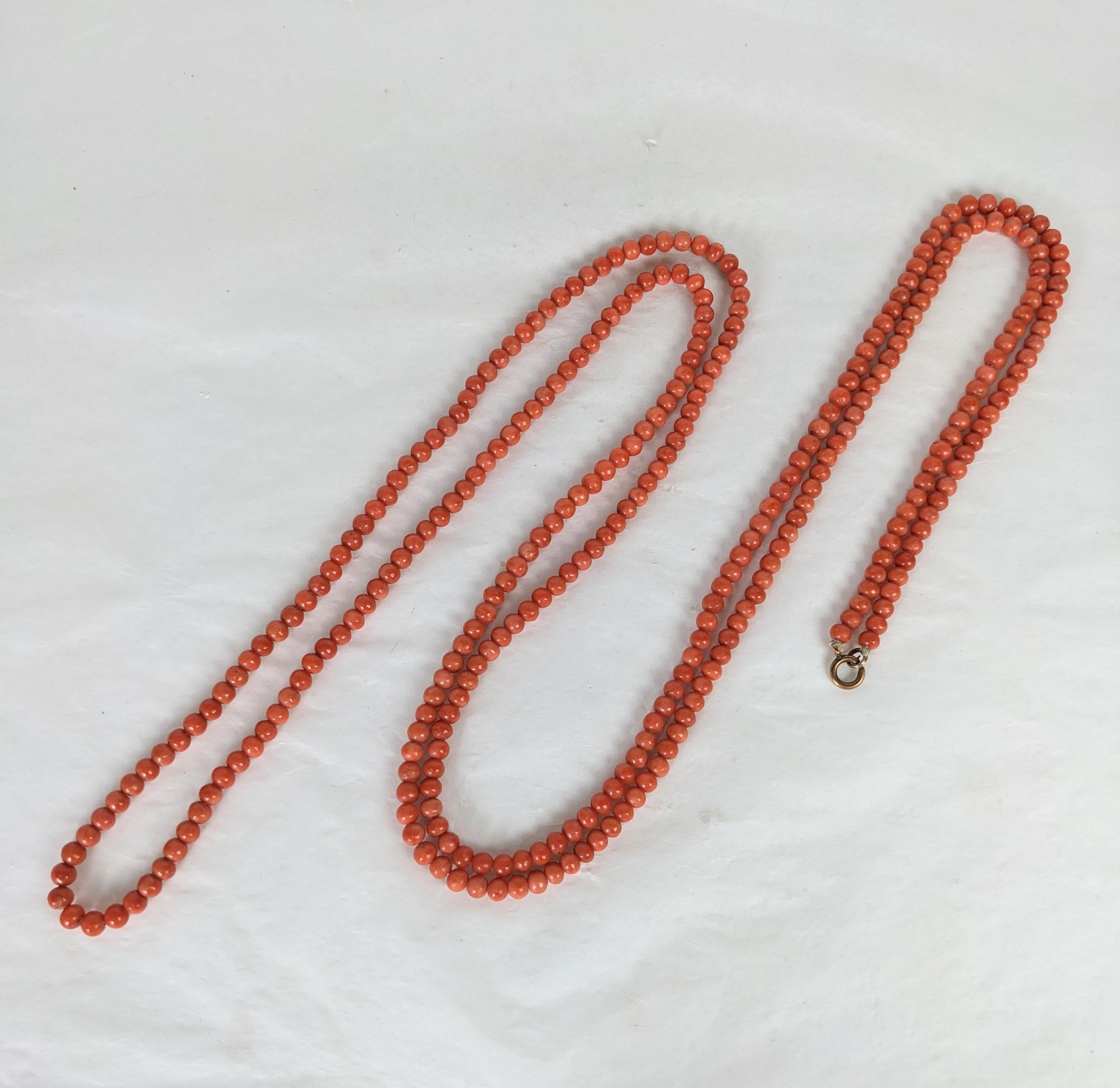 Super Long Victorian Undyed Genuine Coral Beads from the late 19th Century.  Beautiful salmon red-orange color, rare long length, extremely versatile to wrap or use multiple times as a bracelet. 19th Century Italy. Original gold clasp. 5 mm beads.