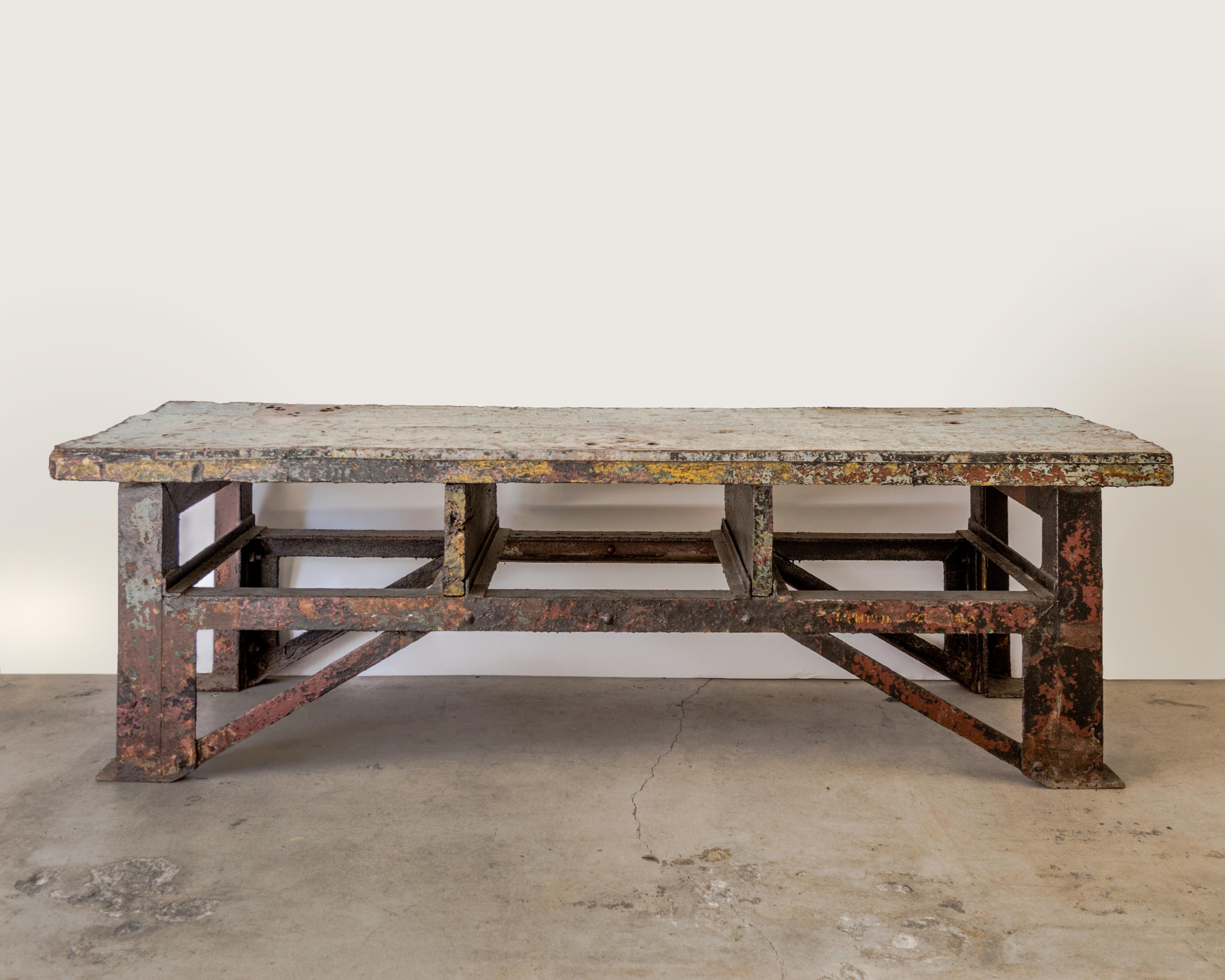 Super industrial table with metal clad wood plank top and steel base, incredible patina, solid and handsome, U.S. mid-20th century.