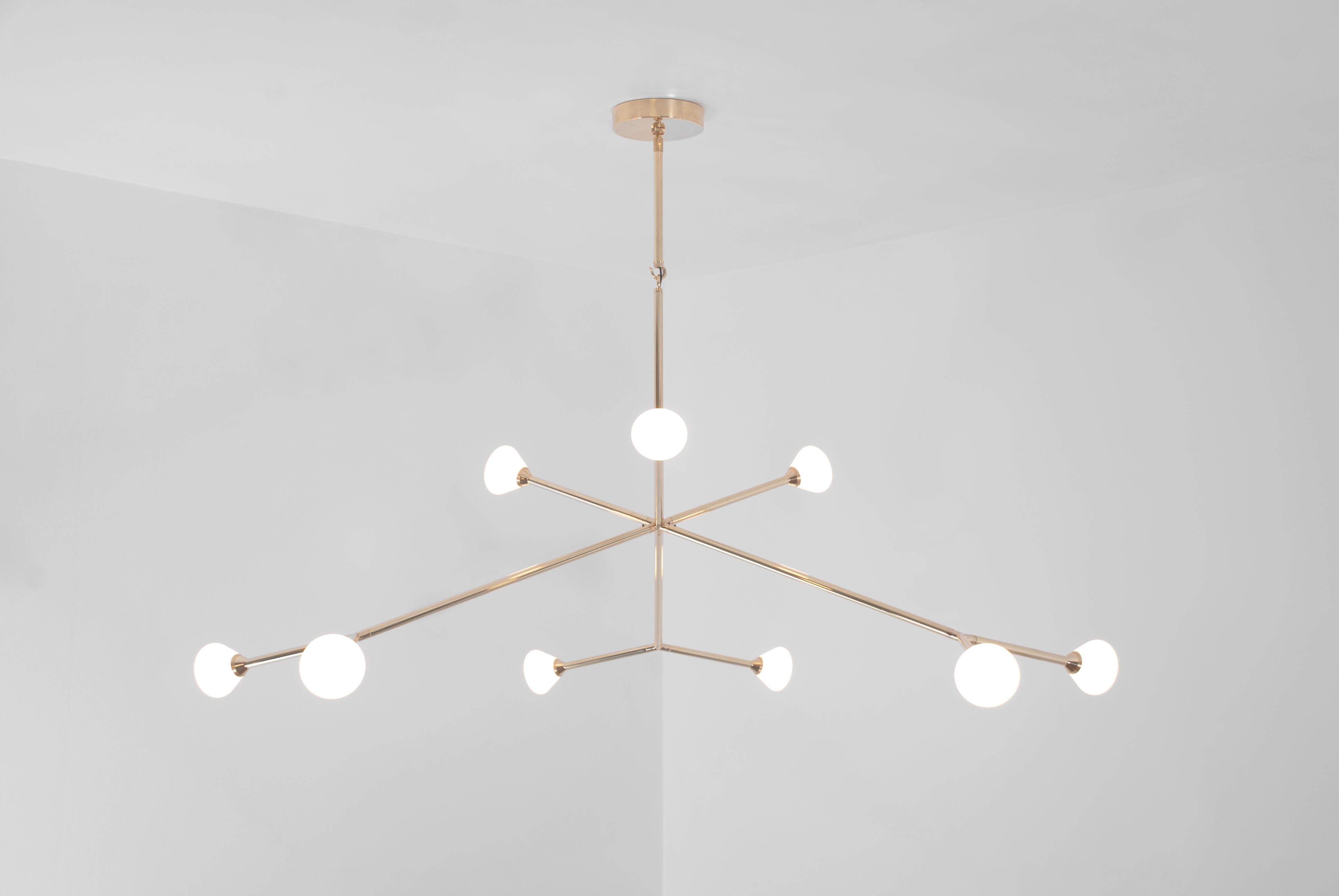 The Super Nova chandelier is centerpiece fixture with an elegant and energetic composition. This contemporary chandelier branches out from a central point in a pure, geometric manner. It features nine white glass shades that house powerful, dimmable