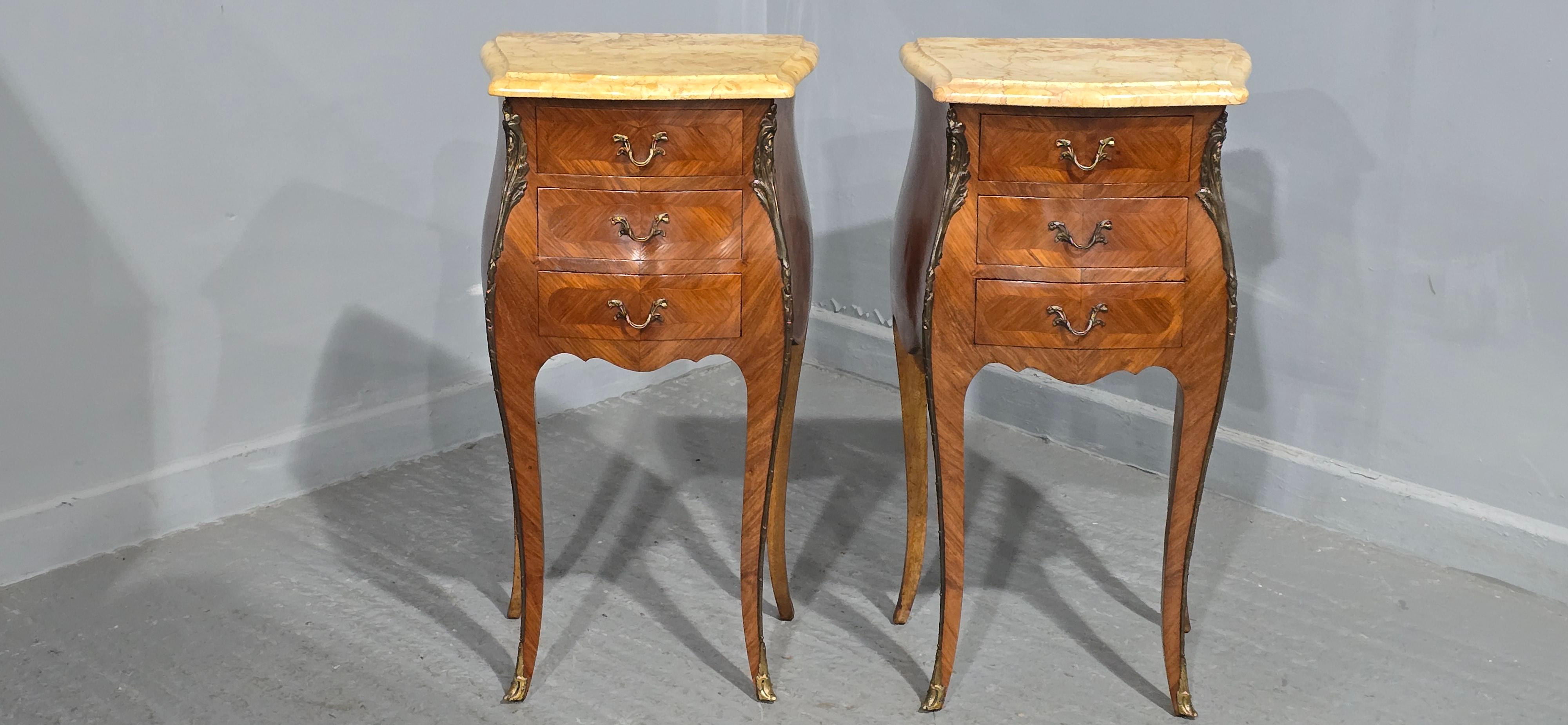 A very good pair of French three drawer bombe shaped tulipwood bedside lamp chests of drawers, with superb marbles, ormolu mounts, oak interiors, in excellent overall condition.

29.5