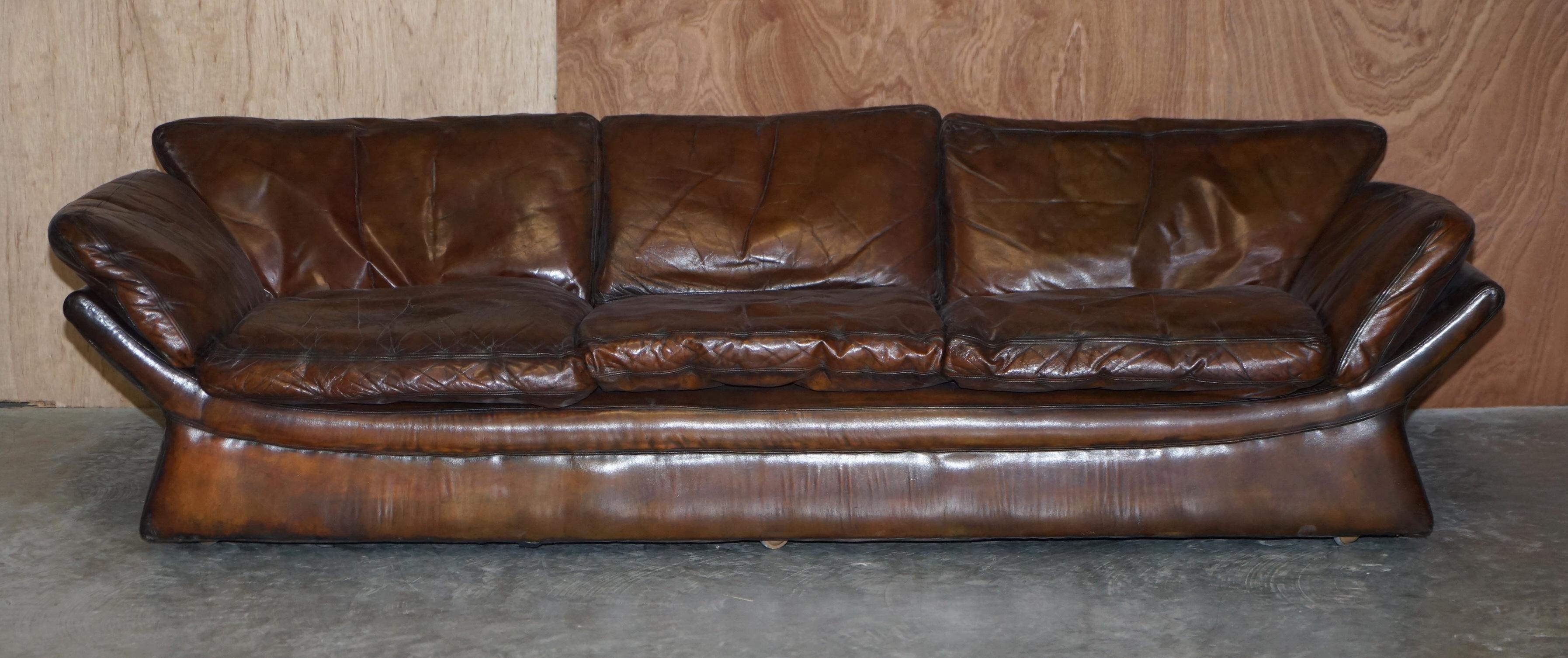 We are delighted to offer for sale this exceptionally rare, super low Mid Century Modern designer restored brown leather sofa

What a sofa! This has to be the coolest sofa I have ever seen in my life, it is so low you are practically sitting on