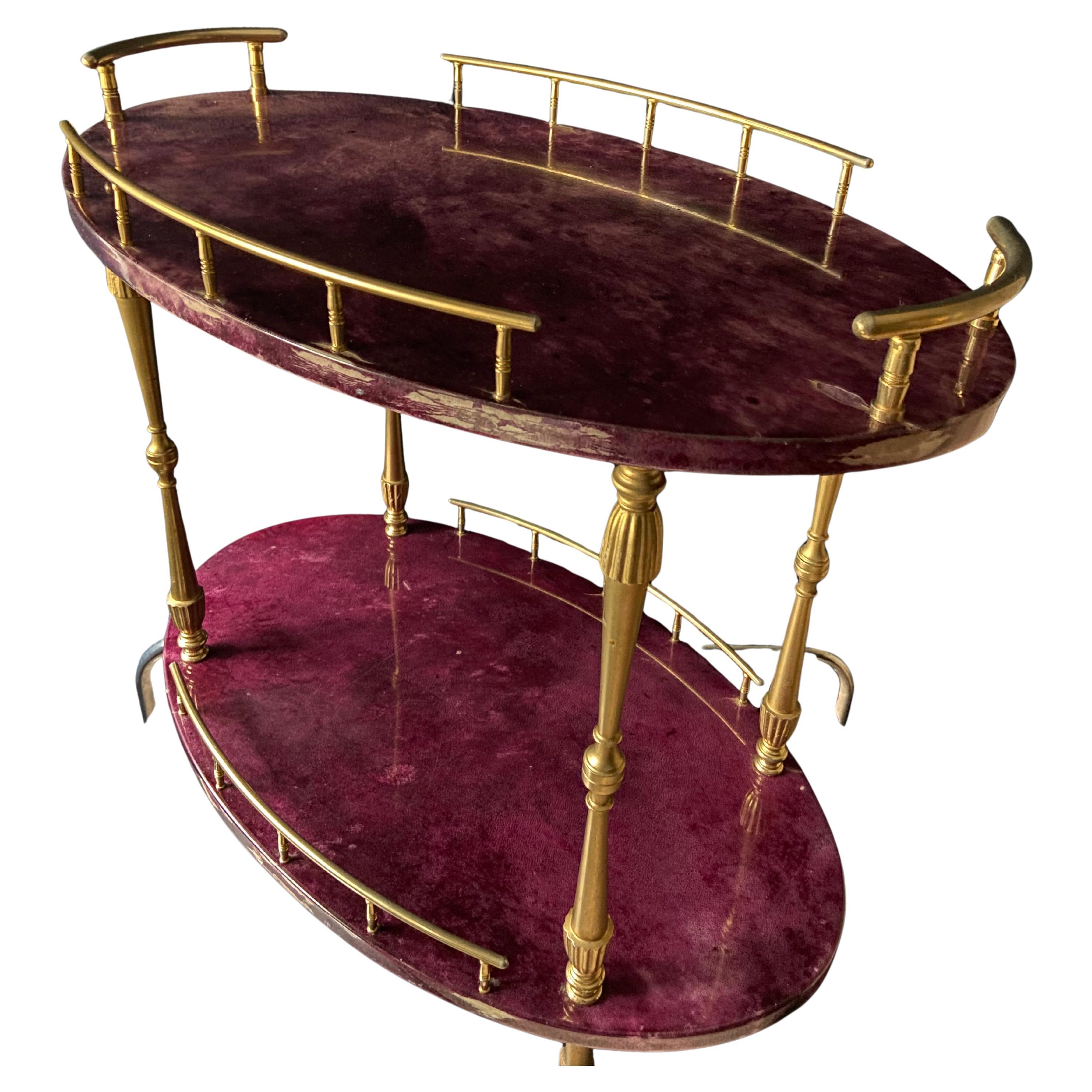 Unlike most Aldo Tura bar carts this super rare find is Aubergine (Eggplant) colored!

Hailing from Milan, this lacquered goatskin trolley was made in the 1960s and shows a variety of marble-like purple tones, reminiscent of the Violet Breche marble