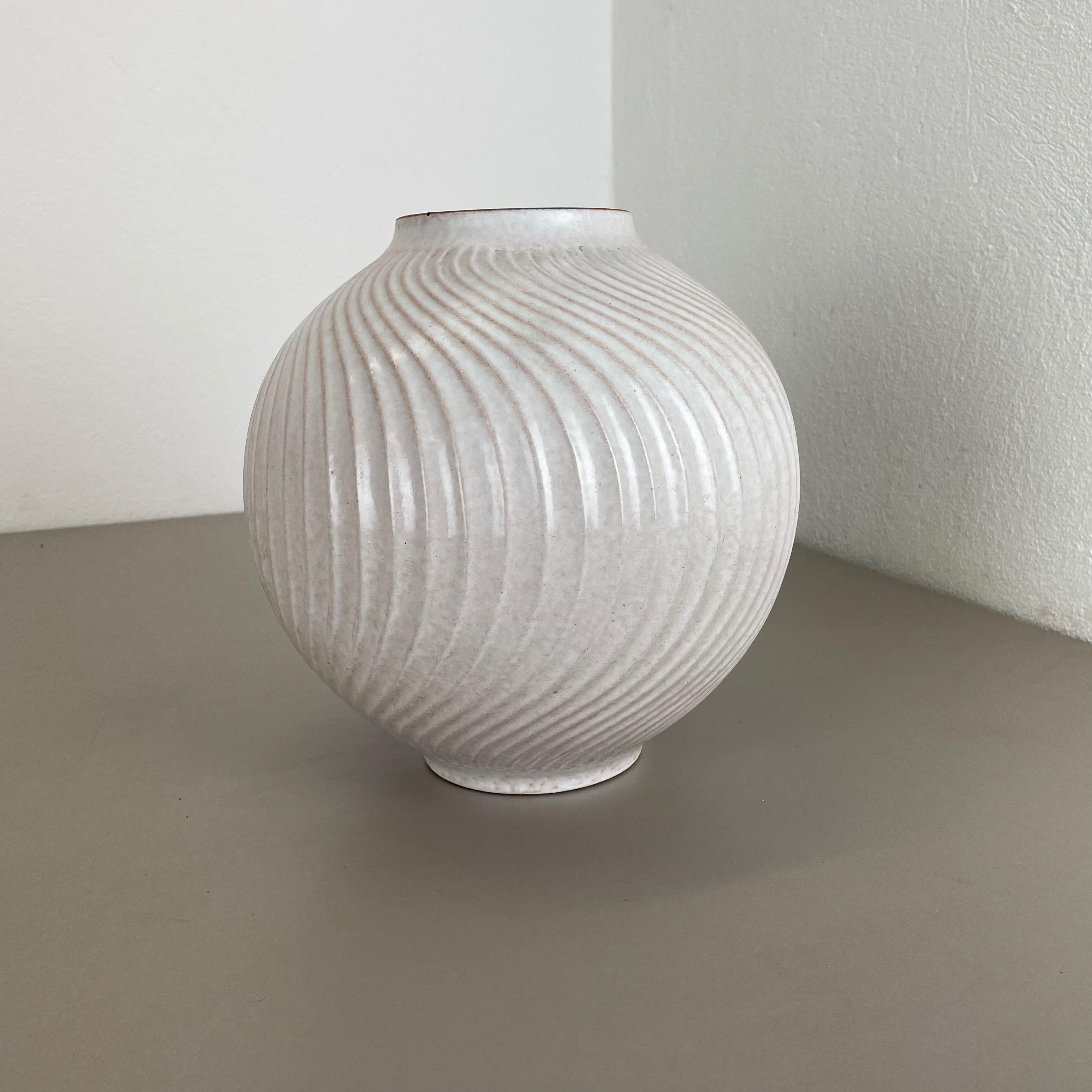 Article:

Pottery ceramic vase


Producer:

Scheurich Ceramic, Germany



Decade:

1970s



Description:

Original vintage 1970s pottery ceramic vase made in Germany. High quality German production with a nice abstract swirl