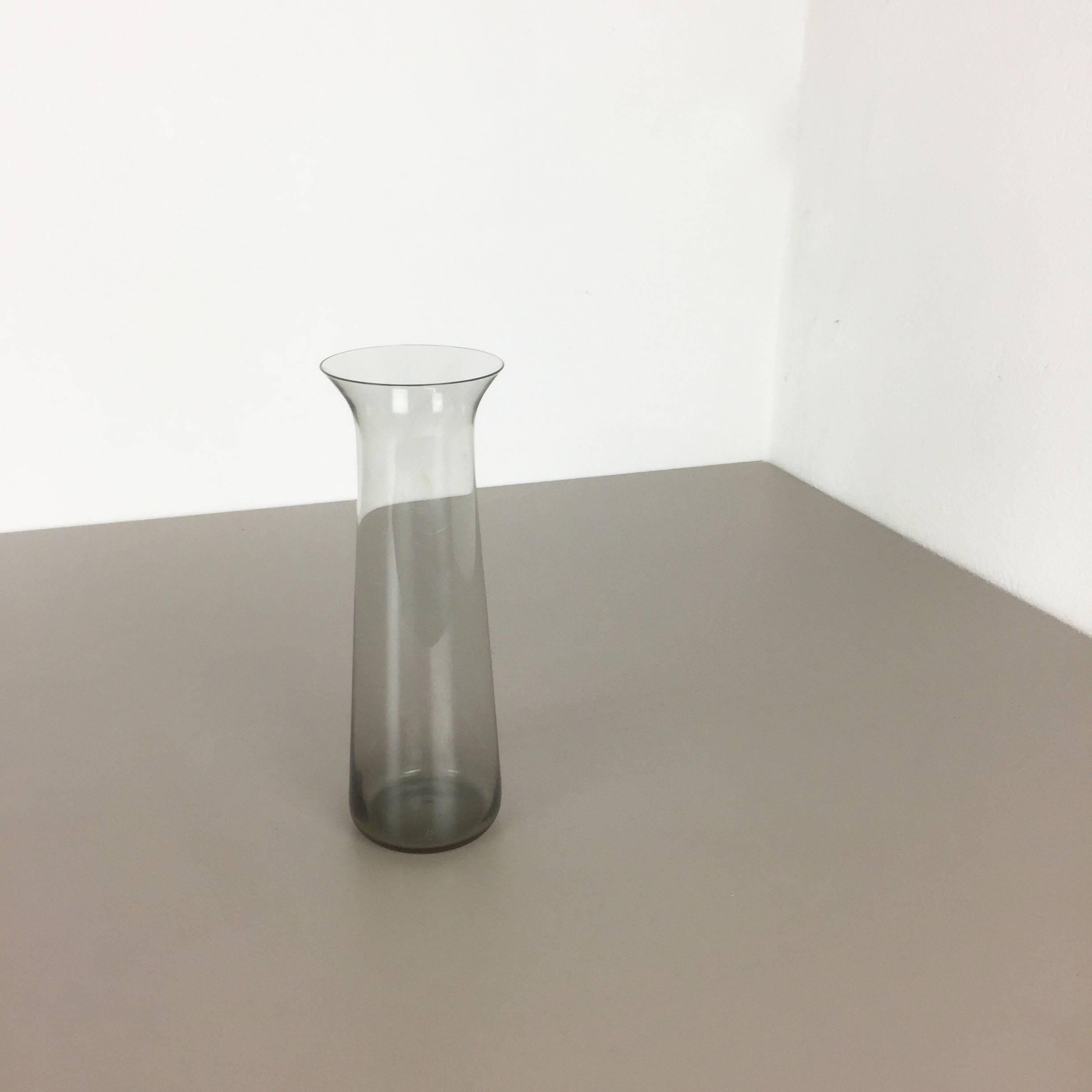 Article:

Glass vase


Producer:

WMF Württembergische Metallwaren Fabrik in Geislingen 


Designer:

Wilhelm Wagenfeld 


Design:

WMF turmalin series


Decade:

1960s


Description:

Original vintage 1960s Vase of the