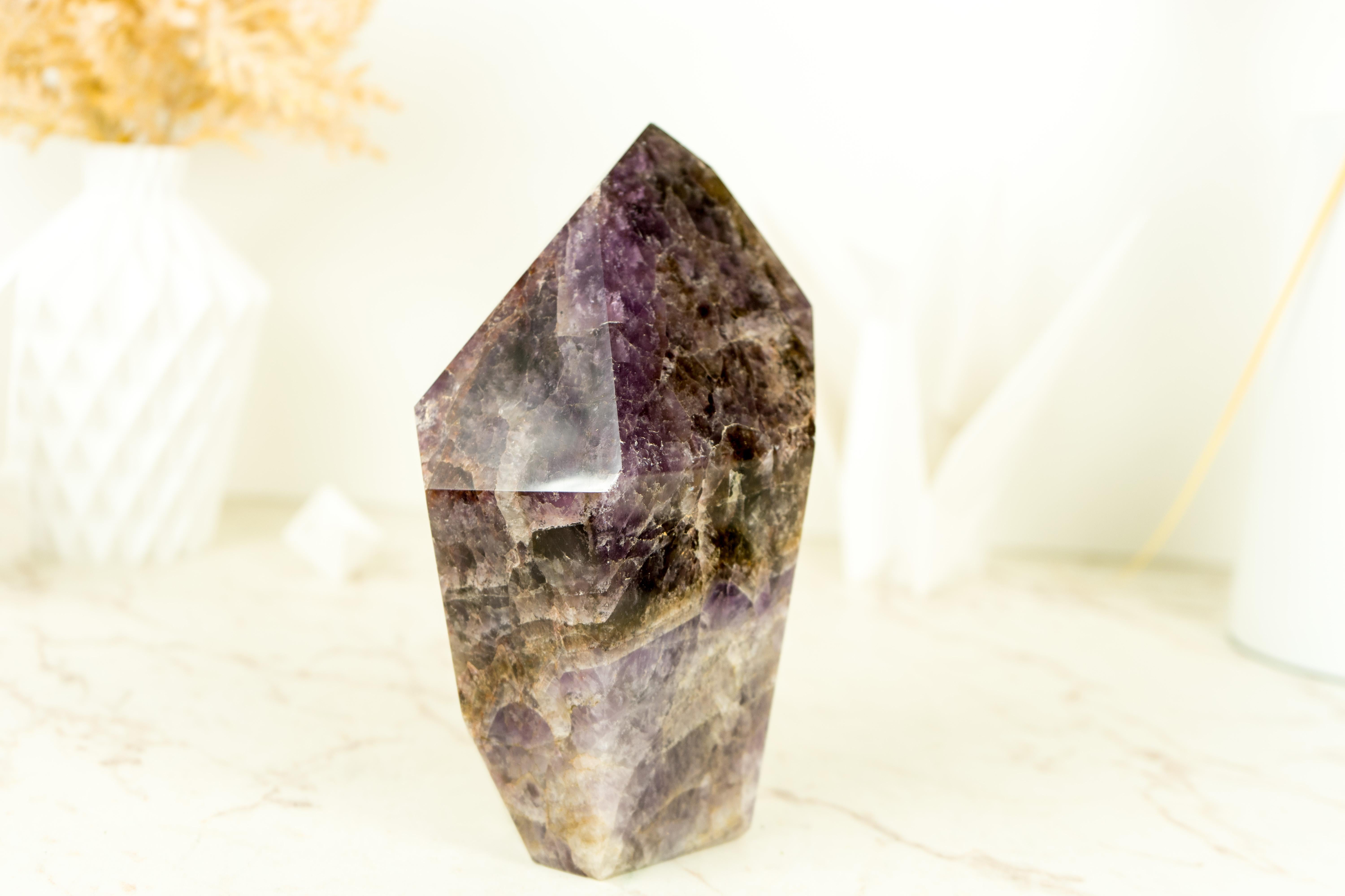 A Large Super Seven Scepter Generator, this self-standing point is a remarkable specimen that showcases both impressive size and unique characteristics. This Super 7 crystal brings beautiful colors on a X-Large point and it's not only a natural