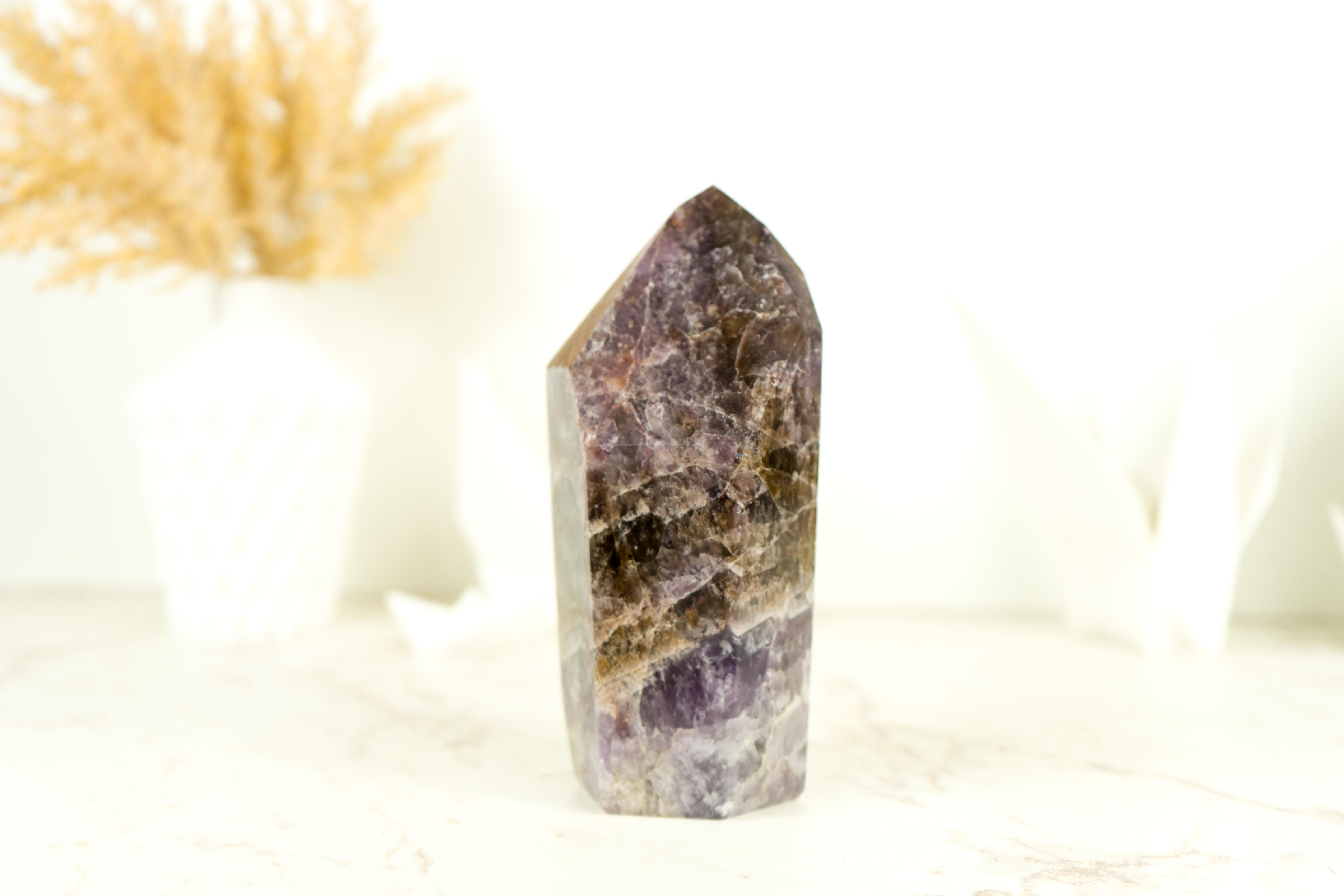A Large Super Seven Scepter Generator, this self-standing point is a remarkable specimen that showcases both impressive size and unique characteristics. This Super 7 crystal is not only a natural wonder but also a desirable addition to any