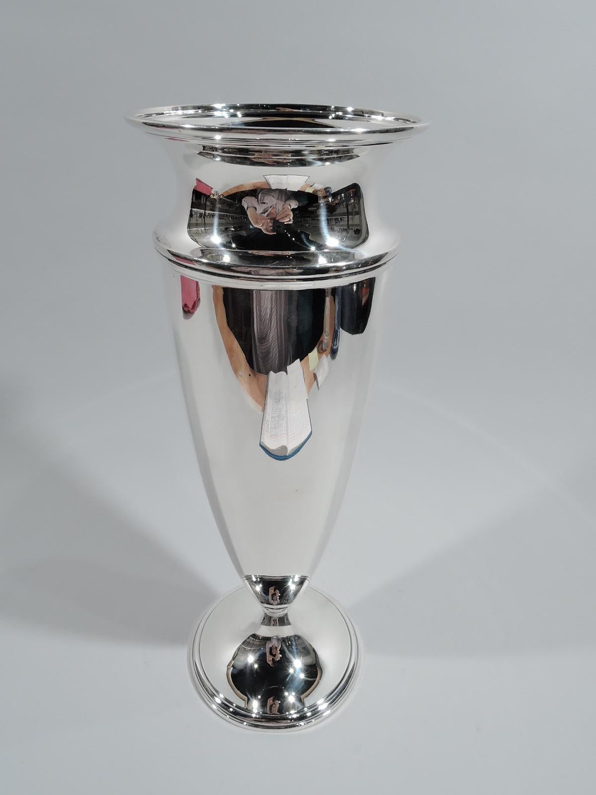 Super stylish Art Deco sterling silver vase. Made by Tiffany & Co. in New York, ca 1925. Tall conical body with spool neck and flared mouth. Foot raised and stepped. Fully marked including pattern no. 20496 (first produced in 1925) and director’s
