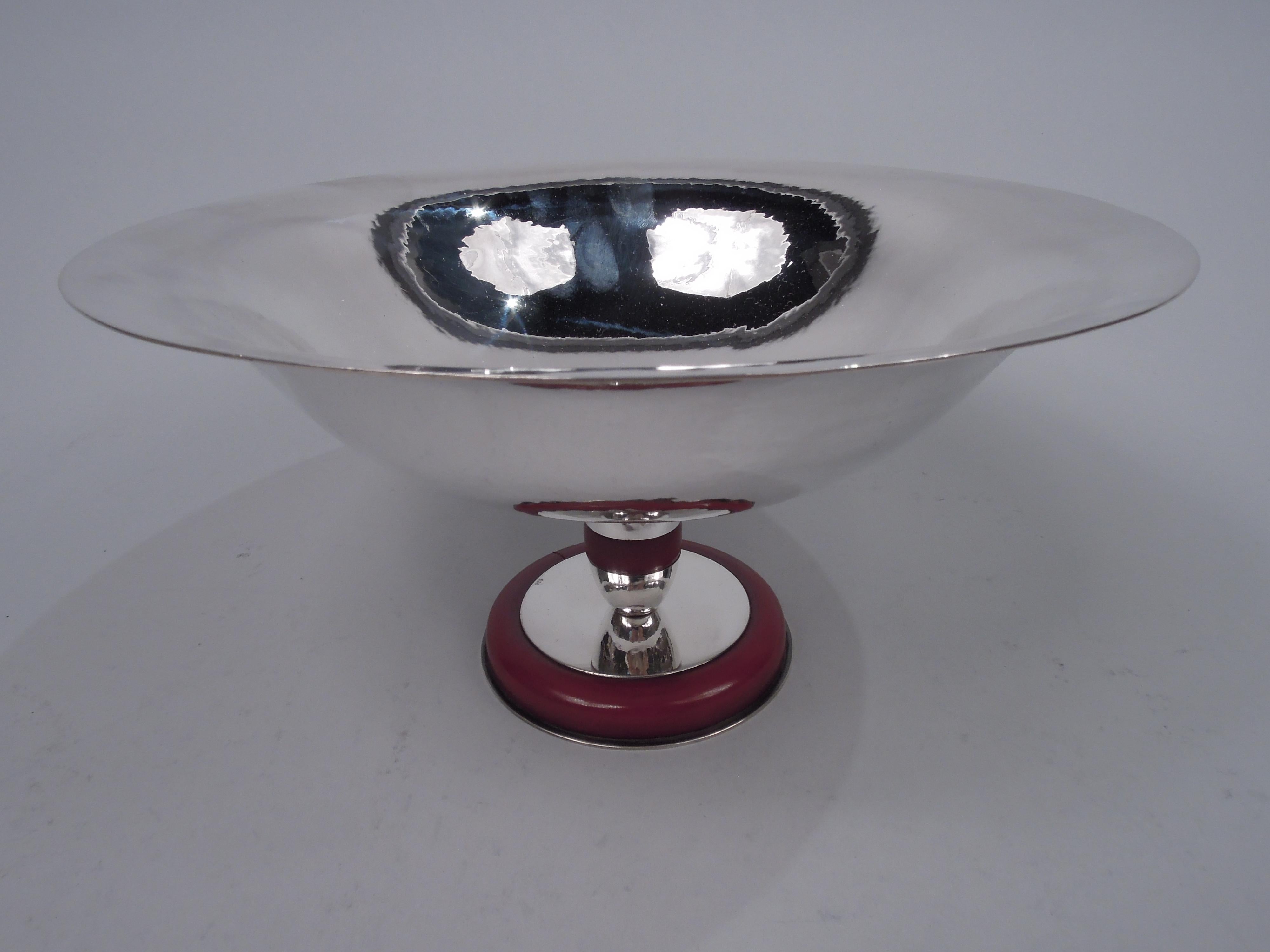 Super stylish Art Deco sterling silver compote. Round bowl with flared rim and curved and tapering sides. Ovoid support with Bakelite band to round foot with same. Visible hand hammering with nice shimmer. Italian marks (1934-44) including