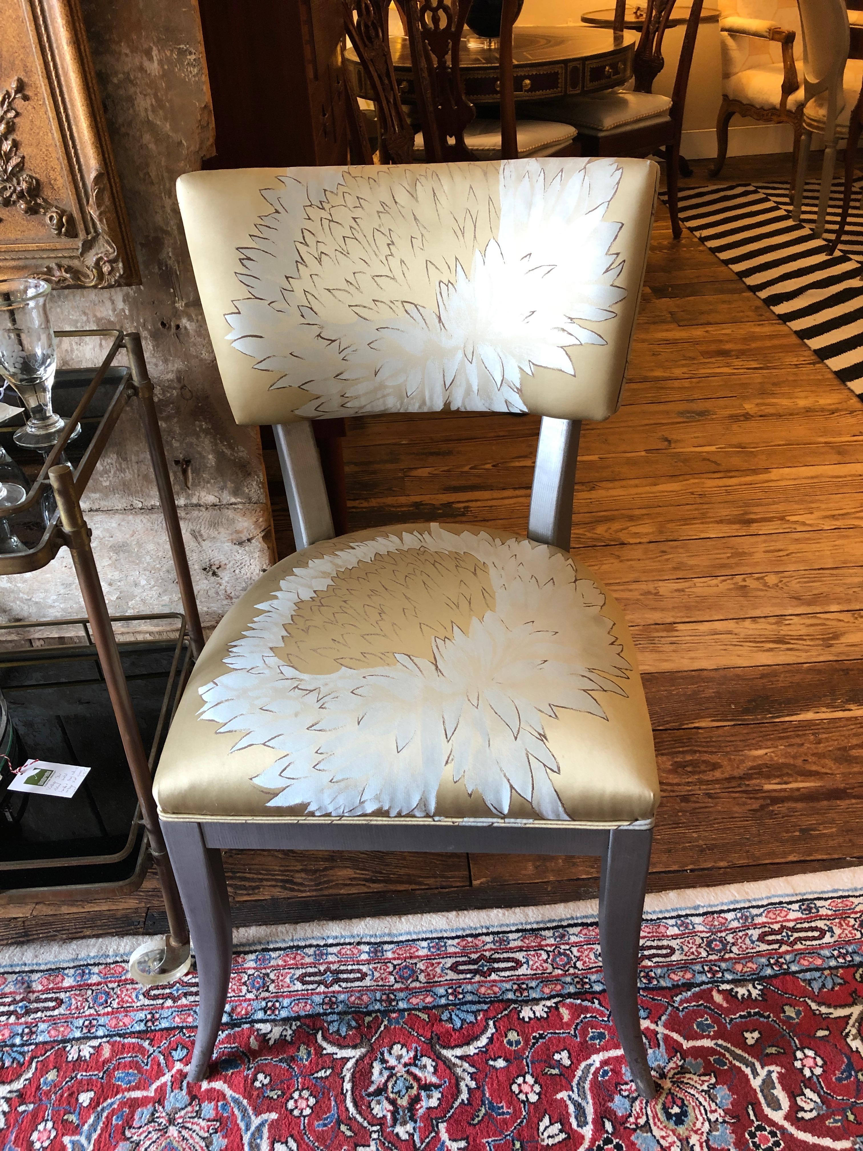 A gorgeous designer custom klismos inspired set of 8 dining chairs having silver glazed wood and stunning Jim Thompson silk upholstery. 
Note:  More fabric is available for purchase.

Measures: seat height 19
seat depth 19
seat width 19.